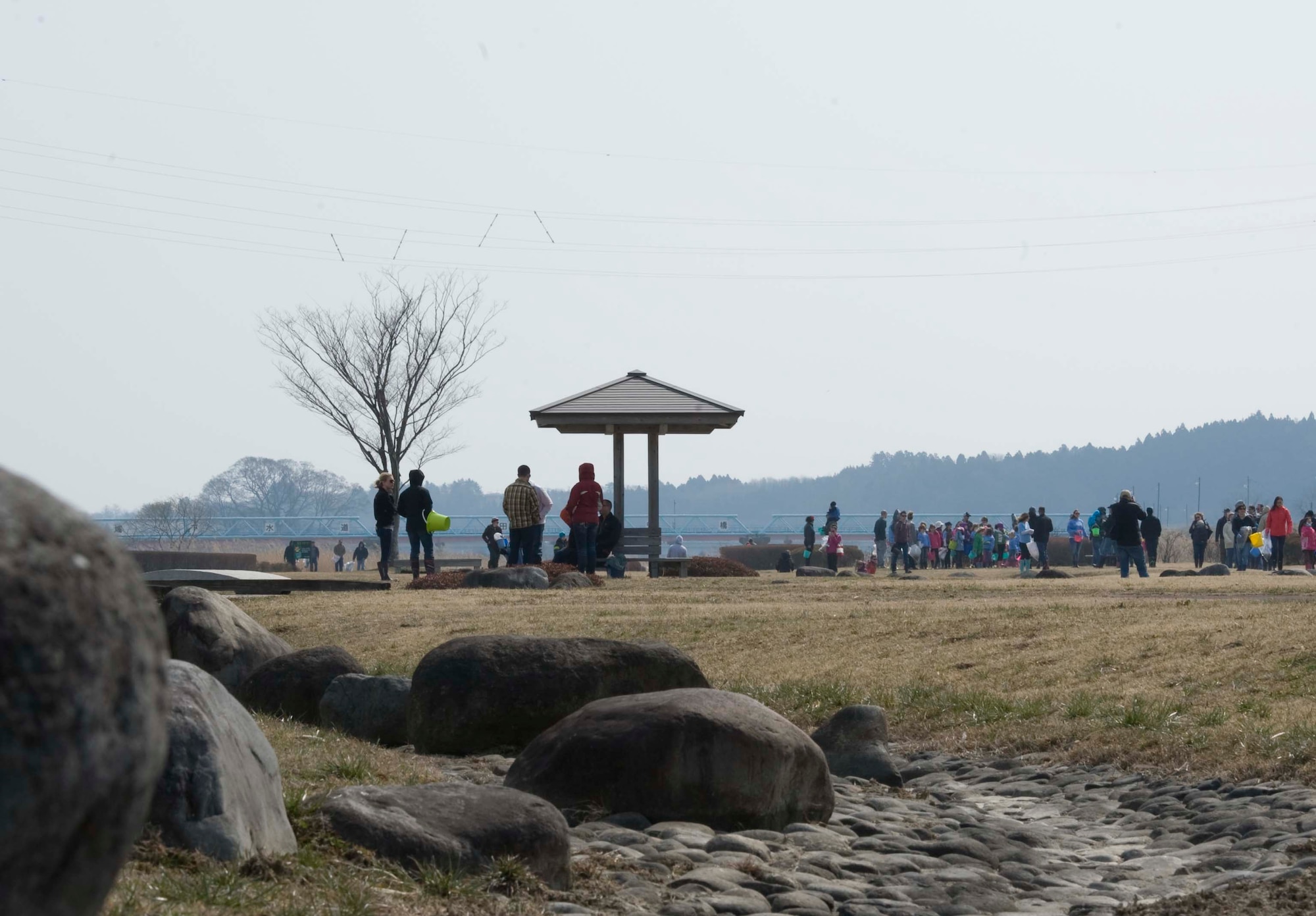Members of Misawa Air Base and the local community tour the Oirase Salmon Park grounds in northern Japan before the start of the 17th Annual Baby Salmon Release March 28, 2015. This bilateral event was conducted as part of Earth Day, which aims to encourage awareness and appreciation for the environment. (U.S. Air Force photo by Airman 1st Class Jordyn Rucker/Released)