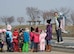 Japanese children wait for the start of the 17th Annual Baby Salmon Release at the Oirase Salmon Park, Japan, March 28, 2015. Children from more than 10 local pre-school and kindergarten classes participated in the event which released over 400,000 baby salmon. (U.S. Air Force photo by Airman 1st Class Jordyn Rucker/Released)