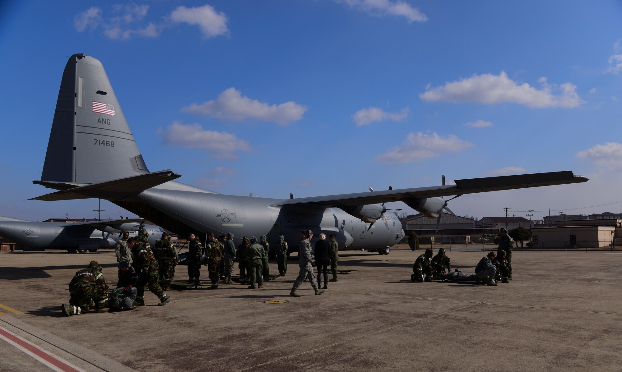 51st Medical Group Airmen receive training on carrying litters during a medical evacuation airlift training scenario March 4, 2015, at Osan Air Base, Republic of Korea. Medical evacuations are a timely and efficient movement and en route care provided by medical personnel to evacuate wounded personnel. (U.S. Air Force photo by Senior Airman David Owsianka)