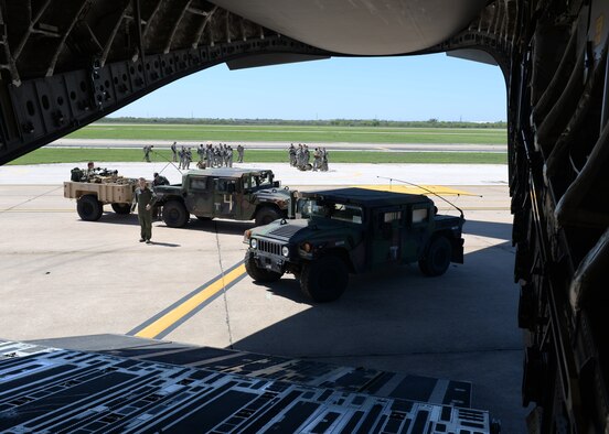 PERRIN AIRFIELD, Texas – U.S. Army soldiers of the 1st Battalion (Airborne), 143rd Infantry Regiment drive two U.S. Army Humvees on a U.S. Air Force C-17 Globemaster III cargo aircraft on the flightline, March 27, 2015. The 143rd Soldiers worked with Airmen from Altus Air Force Base and Little Rock AFB for Operation Viking, a joint-force exercise focused on airfield seizures.  (U.S. Air Force photo by Senior Airman J. Zuriel Lee/Released)