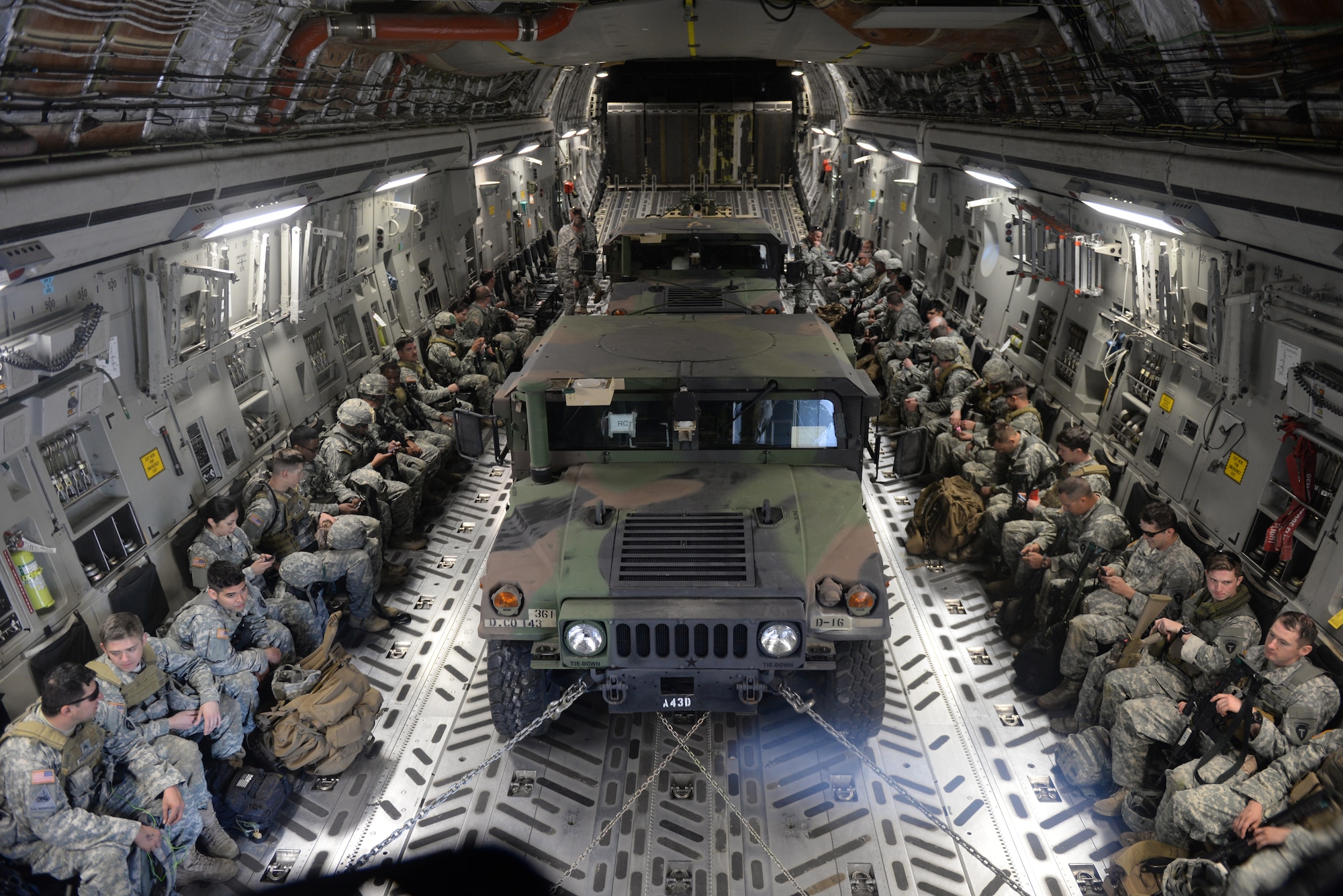 AUSTIN BERGSTROM INTERNATIONAL AIRPORT, Texas – U.S. Army Soldiers of the 1st Battalion (Airborne), 143rd Infantry Regiment prepare for take-off in a U.S. Air Force C-17 Globemaster III cargo aircraft on the flightline during Operation Viking, March 27, 2015. The air landing exercise included setting up security, room clearing procedures and a mortar attack. (U.S. Air Force photo by Senior Airman J. Zuriel Lee/Released)
