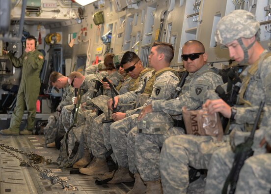 AUSTIN BERGSTROM INTERNATIONAL AIRPORT, Texas – U.S. Army Soldiers of the 1st Battalion (Airborne), 143rd Infantry Regiment prepare for take-off in a U.S. Air Force C-17 Globemaster III cargo aircraft on the flightline during Operation Viking, March 27, 2015. The air landing exercise included setting up security, room clearing procedures and a mortar attack. (U.S. Air Force photo by Senior Airman J. Zuriel Lee/Released)