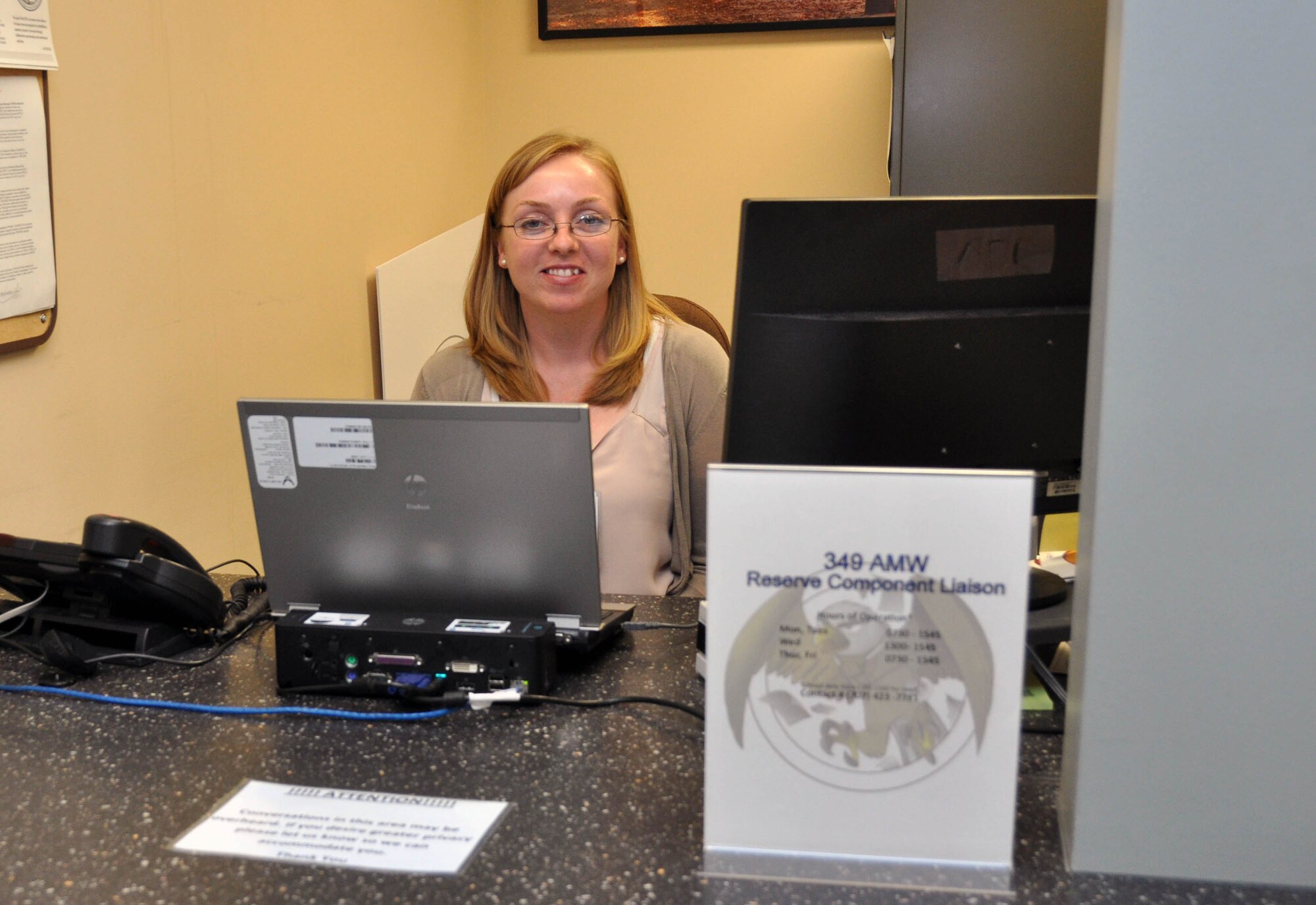 TRAVIS AIR FORCE BASE, Calif. -- Tech. Sgt. Nicole Nagle, 349th Aerospace Medicine Squadron, sits at the new Reserve Component Liaison desk, located on the second floor of David Grant USAF Medical Center, at the first window of the Patient Services Center, March 30, 2015. Nagle serves as the point of contact for Reservists seeking hospital services.(U.S. Air Force photo/Staff Sgt. Cindy G. Alejandrez)