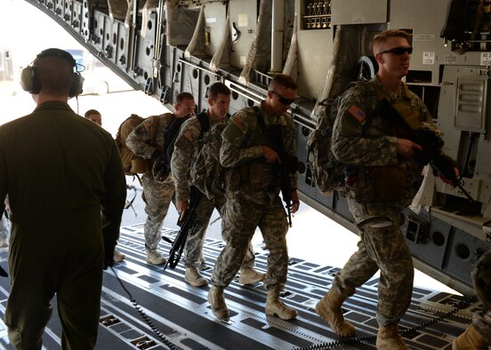 AUSTIN BERGSTROM INTERNATIONAL AIRPORT, Texas – U.S. Army Soldiers of the 1st Battalion (Airborne), 143rd Infantry Regiment board a U.S. Air Force C-17 Globemaster III cargo aircraft on the flightline, March 27, 2015. The 143rd Soldiers worked with Airmen from Altus Air Force Base and Little Rock AFB for Operation Viking, a joint-force exercise focused on airfield seizures. (U.S. Air Force photo by Senior Airman J. Zuriel Lee/Released)