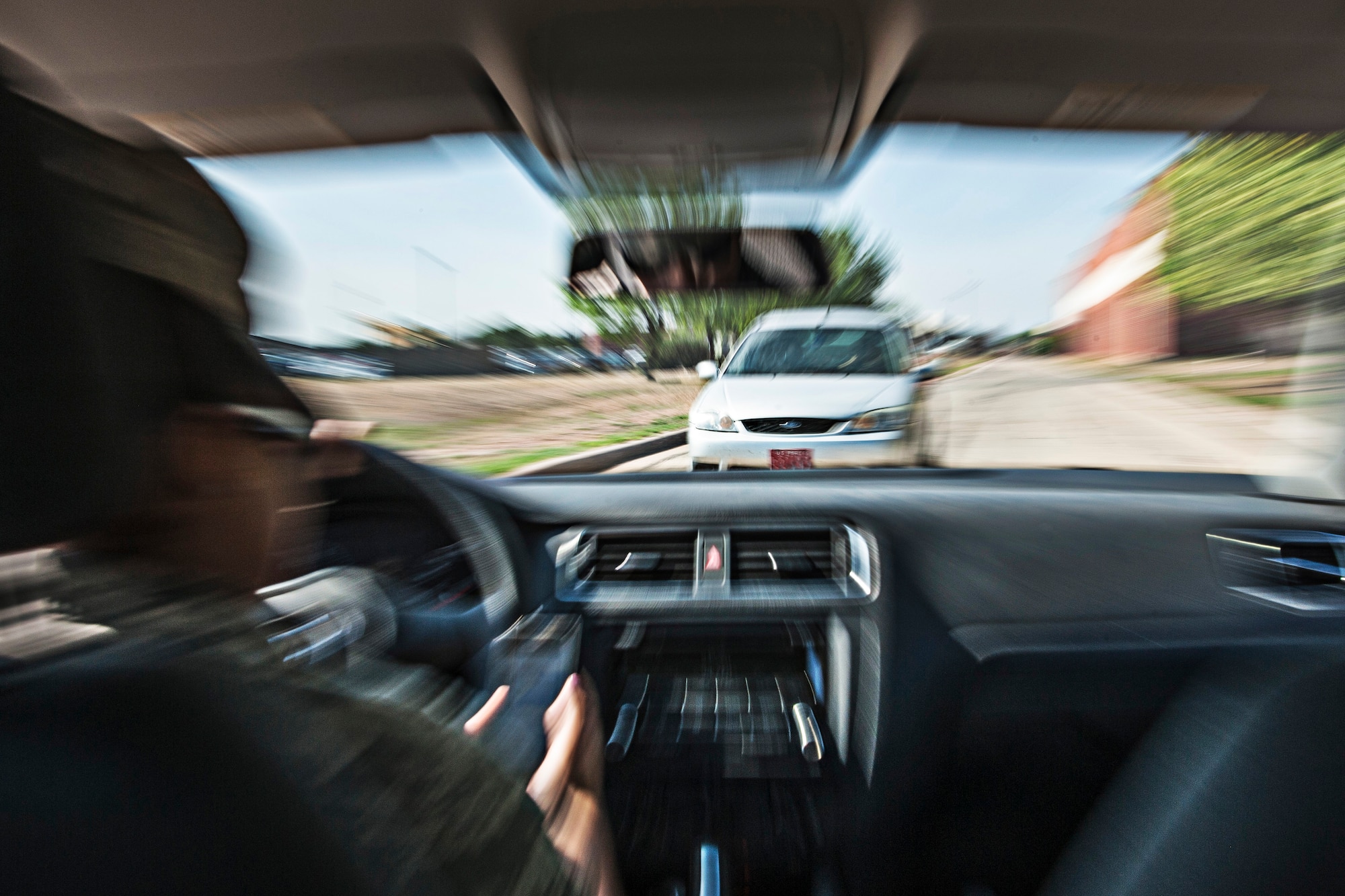 GOODFELLOW AIR FORCE BASE, Texas – An Airman checks her phone while driving May 5, 2014. When talking on a cell phone, drivers can miss seeing up to half of what is around them, such as traffic lights, stop signs and pedestrians. (U.S. Air Force photo/ Senior Airman Michael Smith)