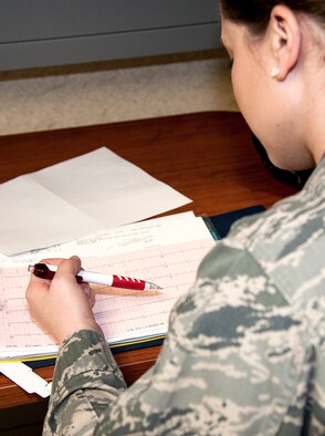 1st Lt. Megan George, of the 96th Medical Group’s Inpatient Squadron, reviews a patient’s electrocardiogram report, Feb. 24 at Eglin Hospital on Eglin Air Force Base, Fla.  The IPTS provides care for all of Eglin’s inpatients.  Approximately 380 – 450 patients are admitted to the Multi-Service Unit for post-surgical care each month. (U.S. Air Force photo/Ilka Cole) 