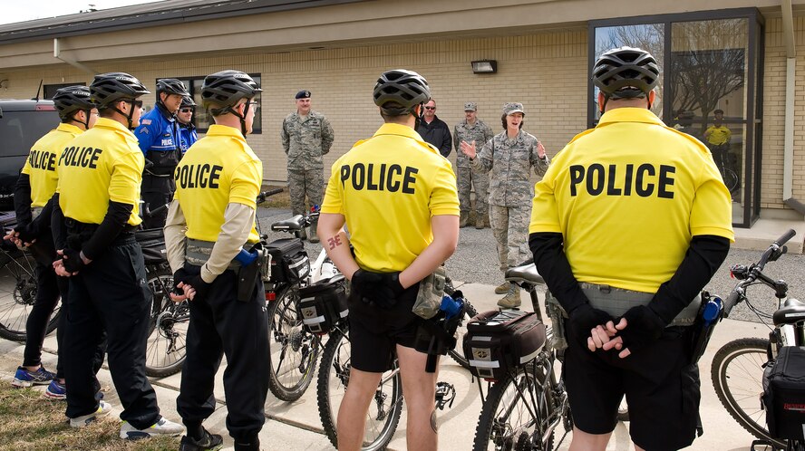 Colonel Lisa Pike, 436th Mission Support Group commander, talks to 436th Security Forces Squadron bike patrol members on their last day of training March 19, 2015, at Dover Air Force Base, Del. Seven 436th SFS members received police mountain bike patrol training March 16-19, 2015, by International Police Mountain Bike Association certified instructors from the Ocean City Police Department, Md. (U.S. Air Force photo/Roland Balik)