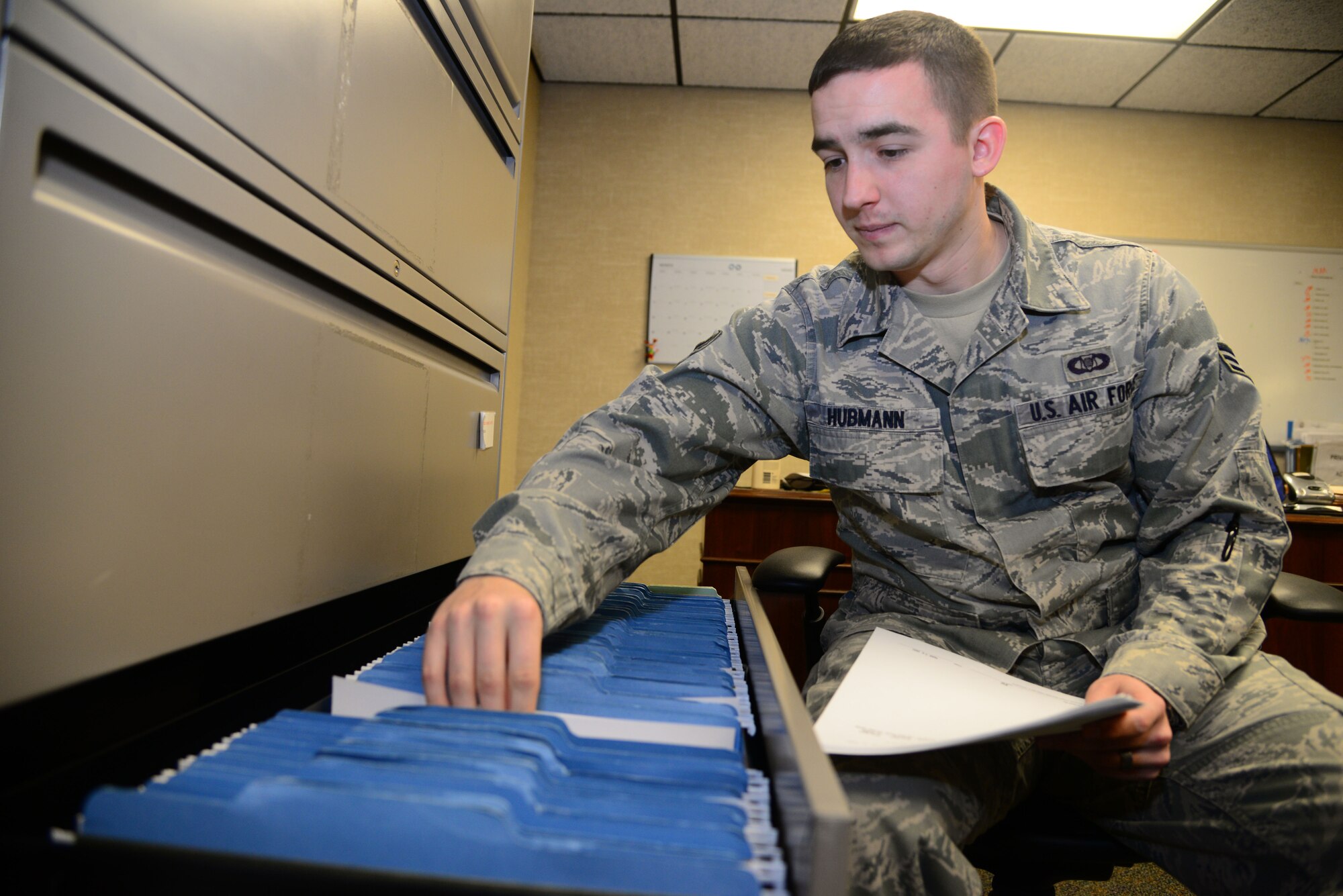 VANCE AIR FORCE BASE, Okla. -- Senior Airman Joshua Hubmann, a 3rd Flying Training Squadron aviation resource manager, files paperwork in his office March 25. Hubmann is the 71st Flying Training Wing Airman of the Month for April. Each month, Airmen are selected to represent their groups and can go on to be selected as the 71st FTW Airman of the Month. (U.S. Air Force photo/Senior Airman Frank Casciotta) 