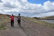 Tech. Sgt. Anthony Davalos (left), Team Red, White and Blue’s activities director, and Anne Marie Scott, Team Rubicon Region-VIII coordinator, begin the “Run as One” trail run at the Lewis and Clark overlook in Great Falls, Mont., March 28, 2015. Run as One was hosted nationwide to raise awareness and honor Marine Corps veteran Clay Hunt, an original member of Team Rubicon who took his life after battling post-traumatic stress and depression. Both organizations are designed around the idea of giving veterans a place to turn to form a lasting bond with the community and one another. (U.S. Air Force photo/Tech. Sgt. Chad Thompson)
