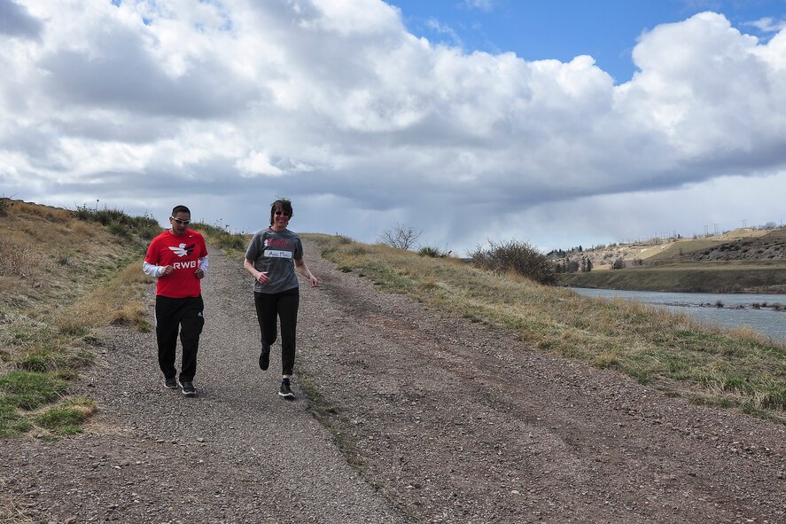 Tech. Sgt. Anthony Davalos (left), Team Red, White and Blue’s activities director, and Anne Marie Scott, Team Rubicon Region-VIII coordinator, begin the “Run as One” trail run at the Lewis and Clark overlook in Great Falls, Mont., March 28, 2015. Run as One was hosted nationwide to raise awareness and honor Marine Corps veteran Clay Hunt, an original member of Team Rubicon who took his life after battling post-traumatic stress and depression. Both organizations are designed around the idea of giving veterans a place to turn to form a lasting bond with the community and one another. (U.S. Air Force photo/Tech. Sgt. Chad Thompson)