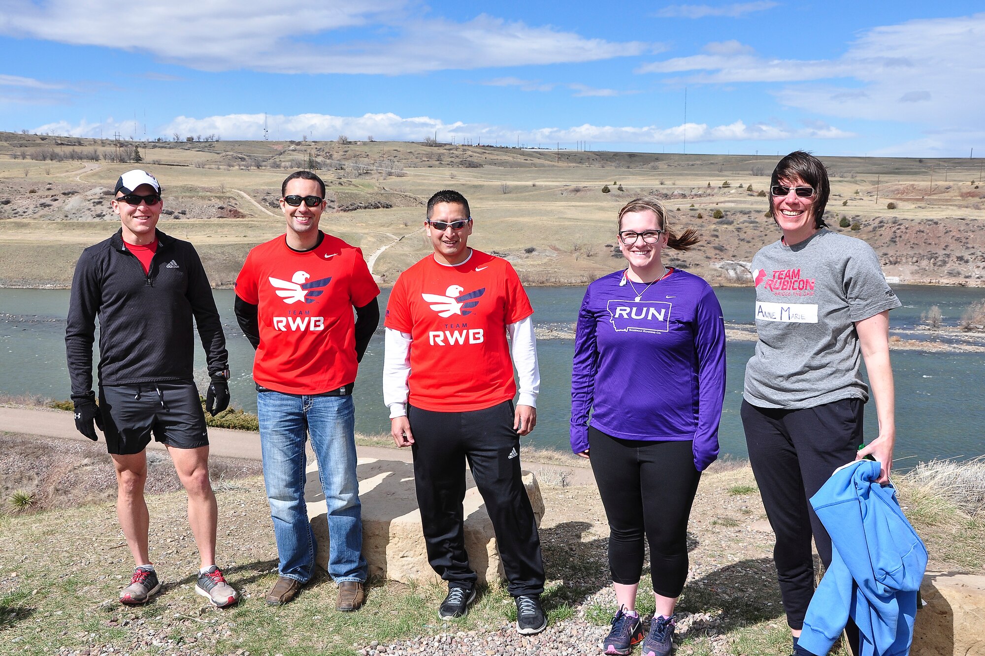 Members of Team Red, White and Blue, and Team Rubicon of Montana pose for a photo before “Run as One” near the Lewis and Clark overlook in Great Falls, Mont., March 28, 2015. Run as One was hosted nationwide to raise awareness and honor Marine Corps veteran Clay Hunt, an original member of Team Rubicon who took his life after battling post-traumatic stress and depression. Both organizations are designed around the idea of giving veterans a place to turn to form a lasting bond with the community and one another. (U.S. Air Force photo/Tech. Sgt. Chad Thompson)