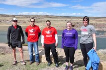 Members of Team Red, White and Blue, and Team Rubicon of Montana pose for a photo before “Run as One” near the Lewis and Clark overlook in Great Falls, Mont., March 28, 2015. Run as One was hosted nationwide to raise awareness and honor Marine Corps veteran Clay Hunt, an original member of Team Rubicon who took his life after battling post-traumatic stress and depression. Both organizations are designed around the idea of giving veterans a place to turn to form a lasting bond with the community and one another. (U.S. Air Force photo/Tech. Sgt. Chad Thompson)