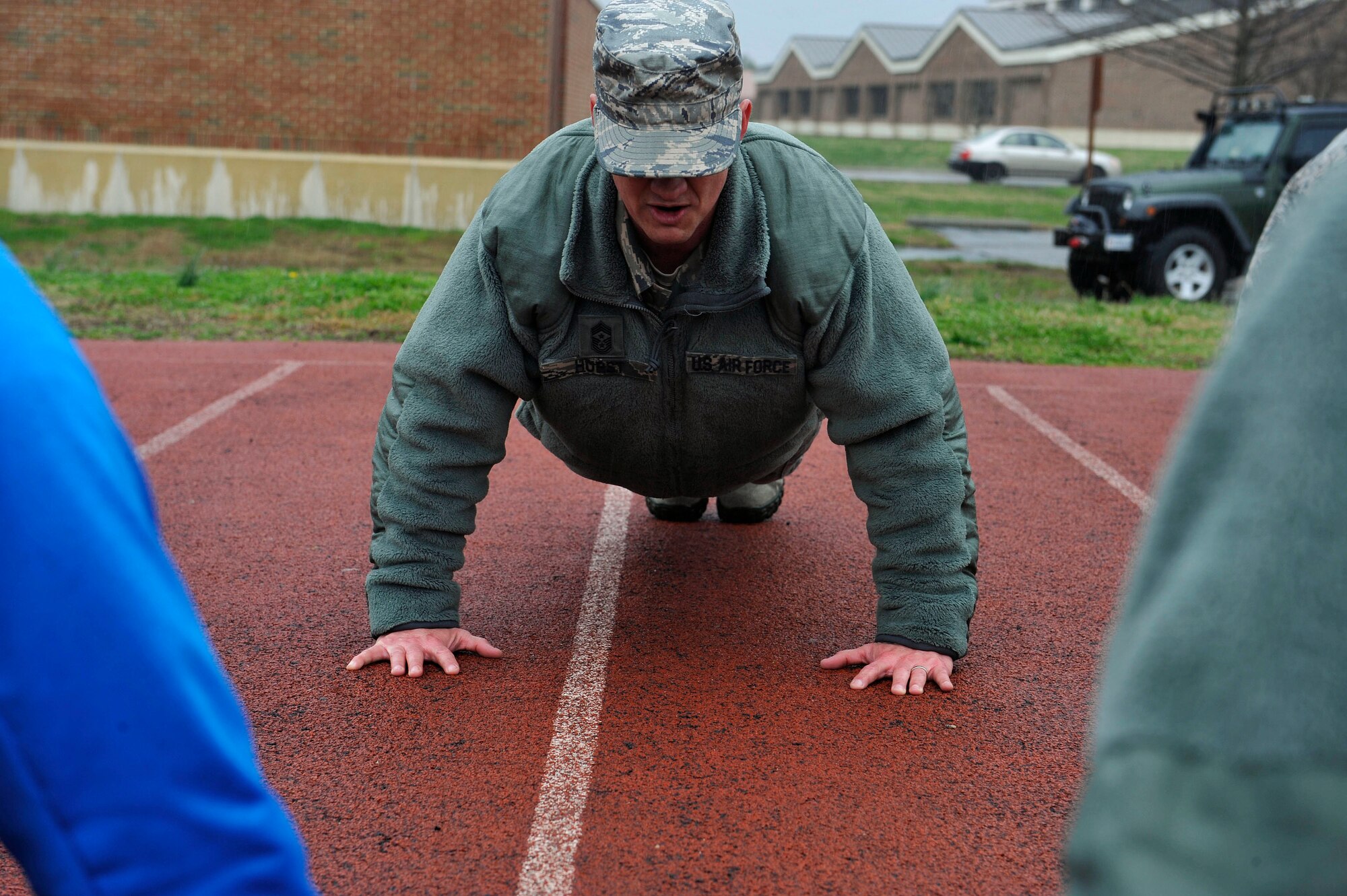 U.S. Air Force Chief Master Sgt. Mark Hurst, 633rd Air Base Wing command chief, does ceremonial push-ups at the end of the 24-hour vigil honoring the fallen members of the Tactical Air Control Party, March 25 and 26, 2015, at Joint Base Langley-Eustis, Va. This event was the third annual event held at JBLE. (U.S. Air Force photo by Senior Airman Breonna Veal/Released)