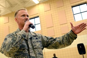 U.S. Air Force Chief Master Sgt. Mark Hurst, 633rd Air Base Wing command chief, speaks during a deployment party in the Community Commons at Langley Air Force Base, Va., March 27, 2015. Hurst spoke of the importance of a family-oriented military community. (U.S. Air Force photo by Airman 1st Class Devin Scott Michaels/Released)