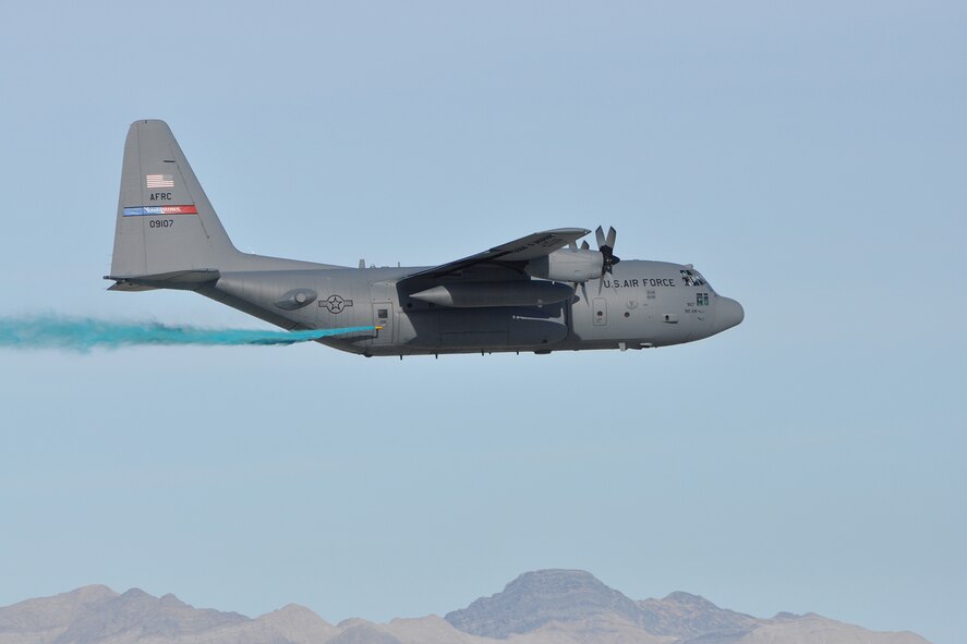 HILL AIR FORCE BASE, Utah – A modified Air Force Reserve C-130 Hercules tactical cargo aircraft, assigned to the 910th Airlift Wing, conducts aerial spray operations at an altitude of approximately 100 feet above the ground over a target site on the Utah Test and Training Range near here, March 18, 2015. The C-130 is flying at the low altitude to control the placement of herbicide onto the selected target areas while conducting a two-week aerial spray mission over UTTR, March 9 – 20, 2015, to eliminate the an unwanted invasive weeds. The 910th, based at Youngstown Air Reserve Station, Ohio, is home to the Department of Defense’s only large area, fixed wing aerial spray capability. U.S. Air Force photo by Master Sgt. Bob Barko Jr.