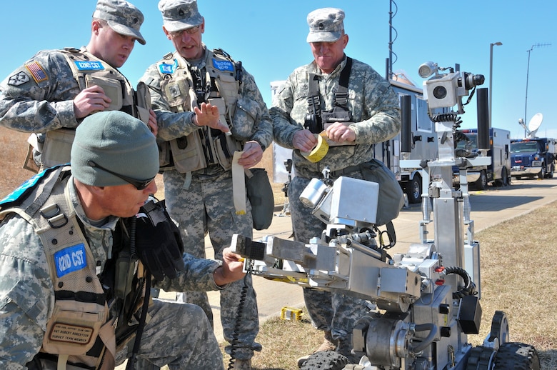 Members of the 82nd Civil Support Team (WMD) prepare the down range monitoring equipment (bomb robot) to inspect the incident exercise area at the water reclamation plant in Sioux Falls, S.D., March 19, 2015. CST will dress the robot with an array of chemical and radiation monitoring equipment to detect if there is a hazard present in order to determine what level of personal protective equipment (PPE) is needed to make entry into the incident area.(National Guard photo by Staff Sgt. Luke Olson/Released)