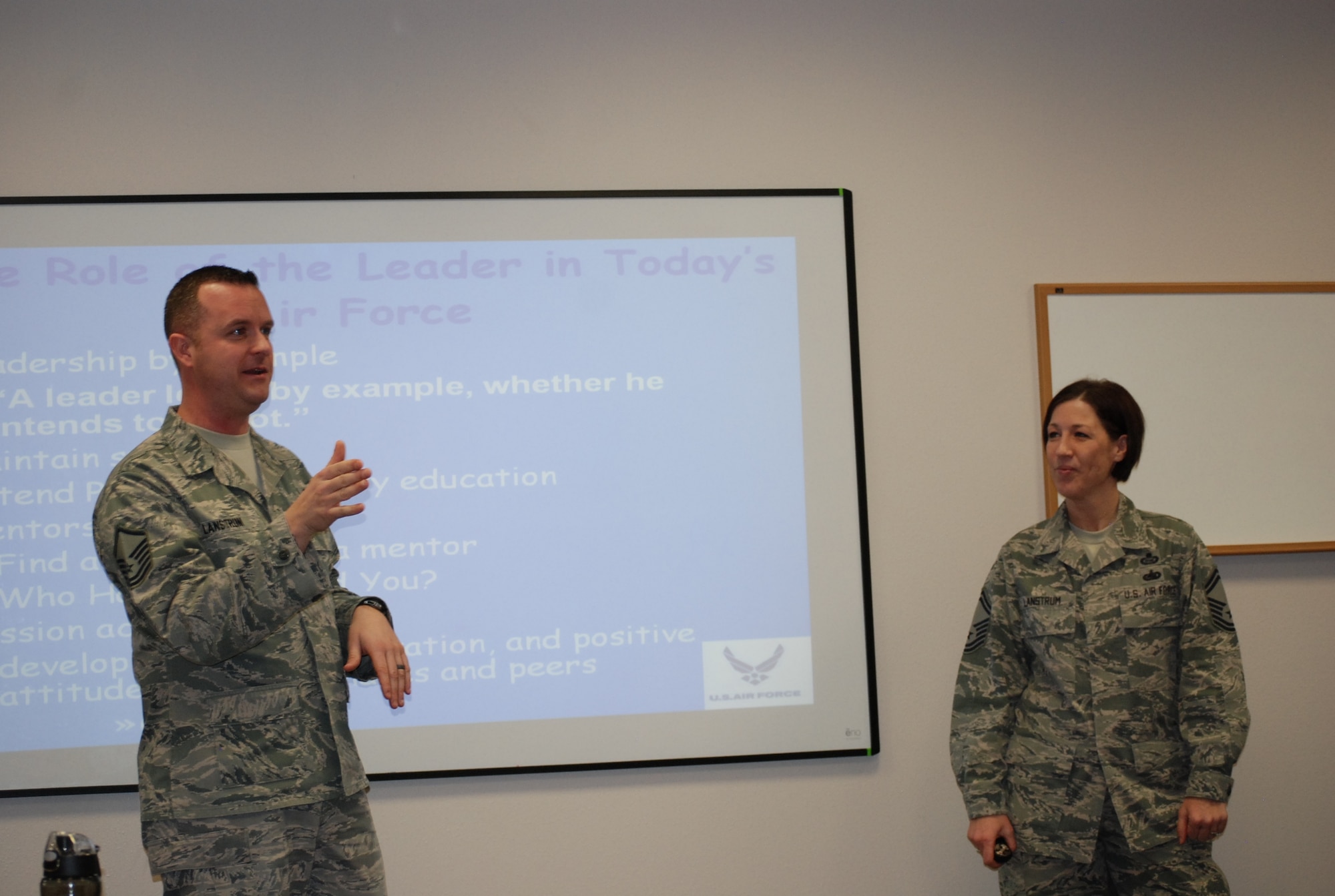 PETERSON AIR FORCE BASE, Colo. -- Master Sgt. George Lanstrum (left), 21st Security Forces Squadron superintendent of standard evaluation and training (left), and Senior Master Sgt. Nicole Lanstrum, Manager and Senior Intelligence Officer Staff at Headquarters Air Force Space Command, team- teach the “Leadership…It’s a Choice” course held in the First Term Airman’s Center March 4. The pair taught using their varied experiences by providing different leadership tools for students to use. (U.S. Air Force photo by Dave Smith)