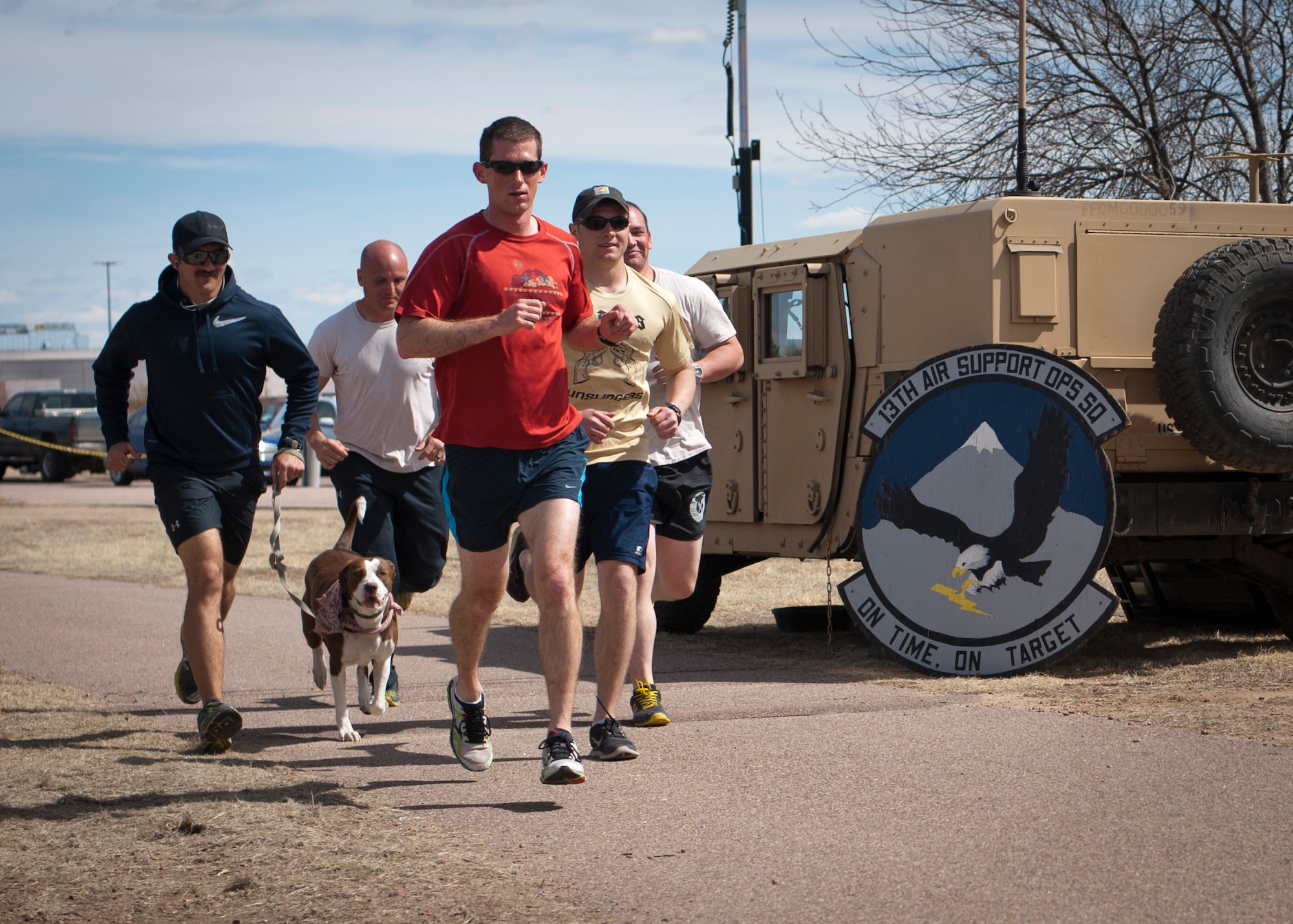 PETERSON AIR FORCE BASE, Colo. -- A group of tactical air control party Airmen from the 13th Air Support Operations Squadron complete a lap around a mile-long course during the fourth annual 24-hour Tactical Air Control Party Awareness Run at Peak View Park on Peterson AFB, March 26. The purpose of the run was to raise awareness and generate donations for the TACP Association. The money generated by this event helps to support the families of fallen TACP members as well as disabled TACP Airmen. (U.S. Air Force photo by Staff Sgt. J. Aaron Breeden)