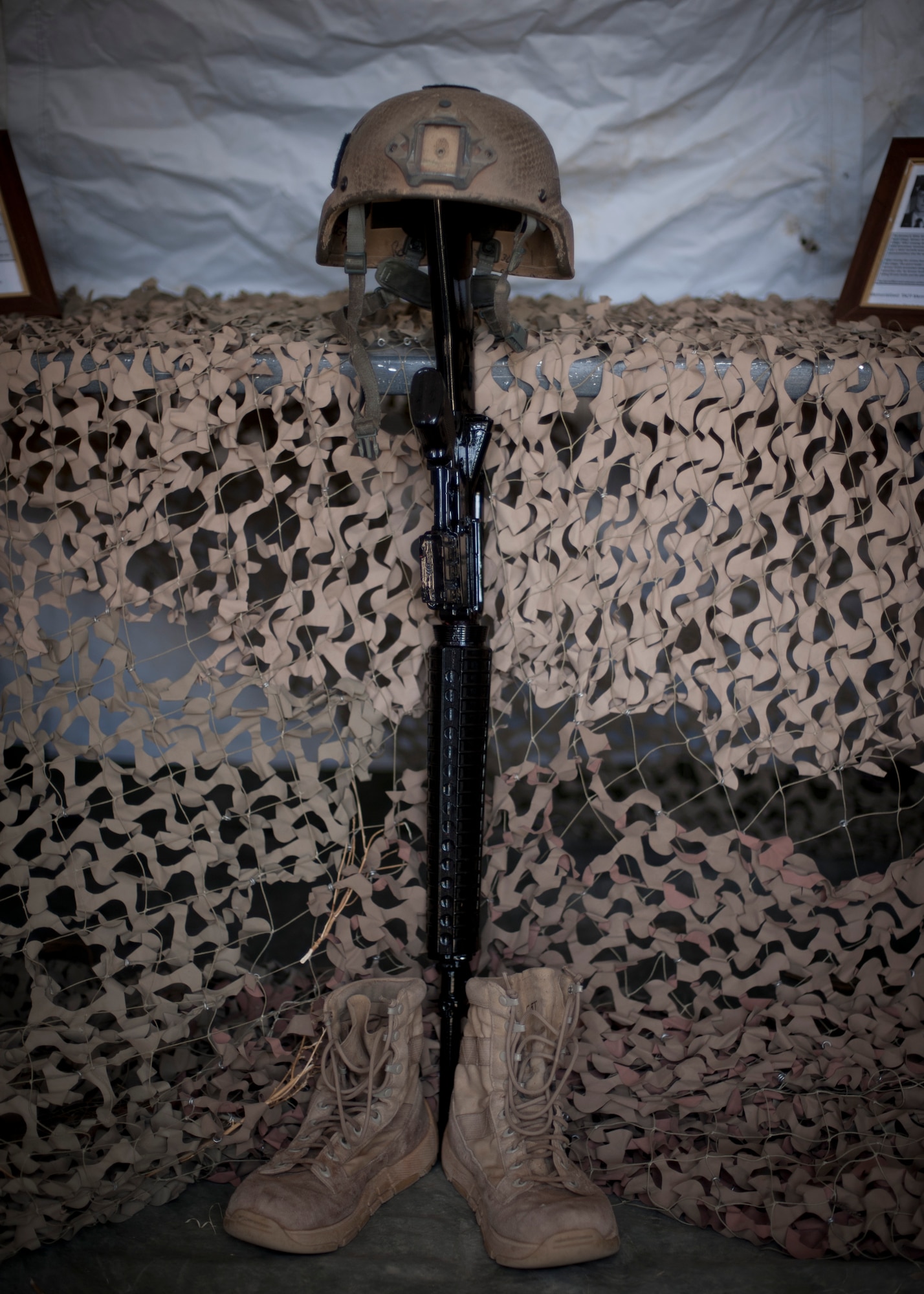 PETERSON AIR FORCE BASE, Colo. -- A helmet, M-16 rifle and pair of boots, or “battlefield cross,” sit on display in the remembrance tent during the fourth annual 24-hour Tactical Air Control Party Awareness Run at Peak View Park on Peterson AFB, March 26. The purpose of the run was to raise awareness and generate donations for the TACP Association. The money generated by this event helps to support the families of fallen TACP members as well as disabled TACP Airmen. (U.S. Air Force photo by Staff Sgt. J. Aaron Breeden)