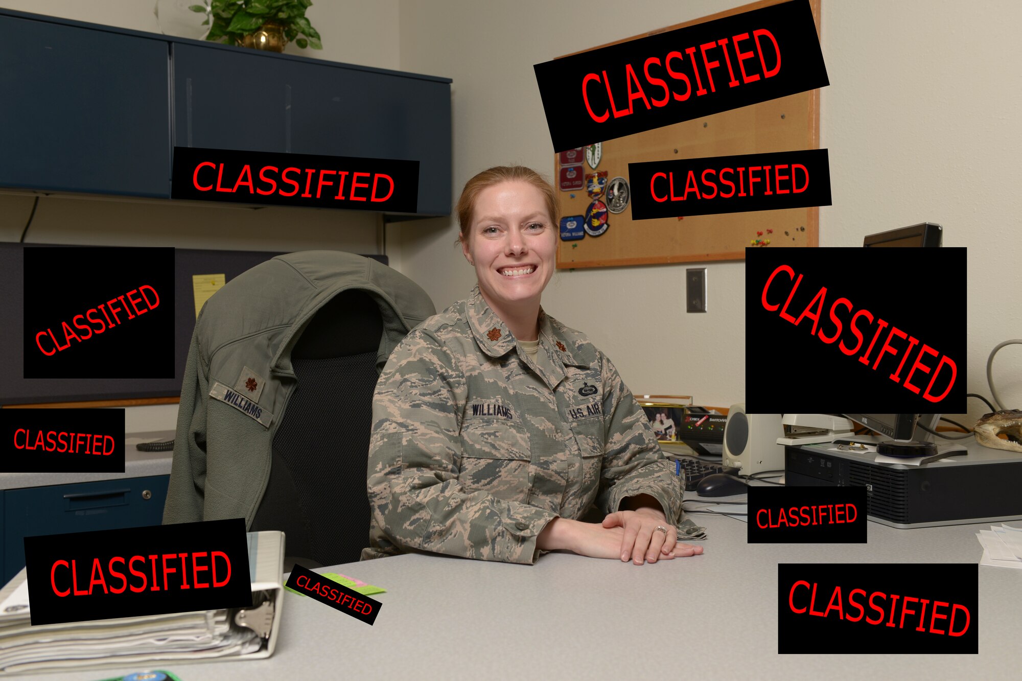 U.S. Air Force Maj. Victoria Williams, the 354th Fighter Wing senior intelligence officer, takes a quick break from work at Eielson Air Force Base, Alaska, March 26, 2015. Williams advises the wing commander and senior leaders on any threats to their forces at home or deployed and manages intelligence professionals assigned to the wing. (U.S. Air Force photo illustration by Senior Airman Peter Reft/Released) (This image was manipulated by adding boxes and text to original image)