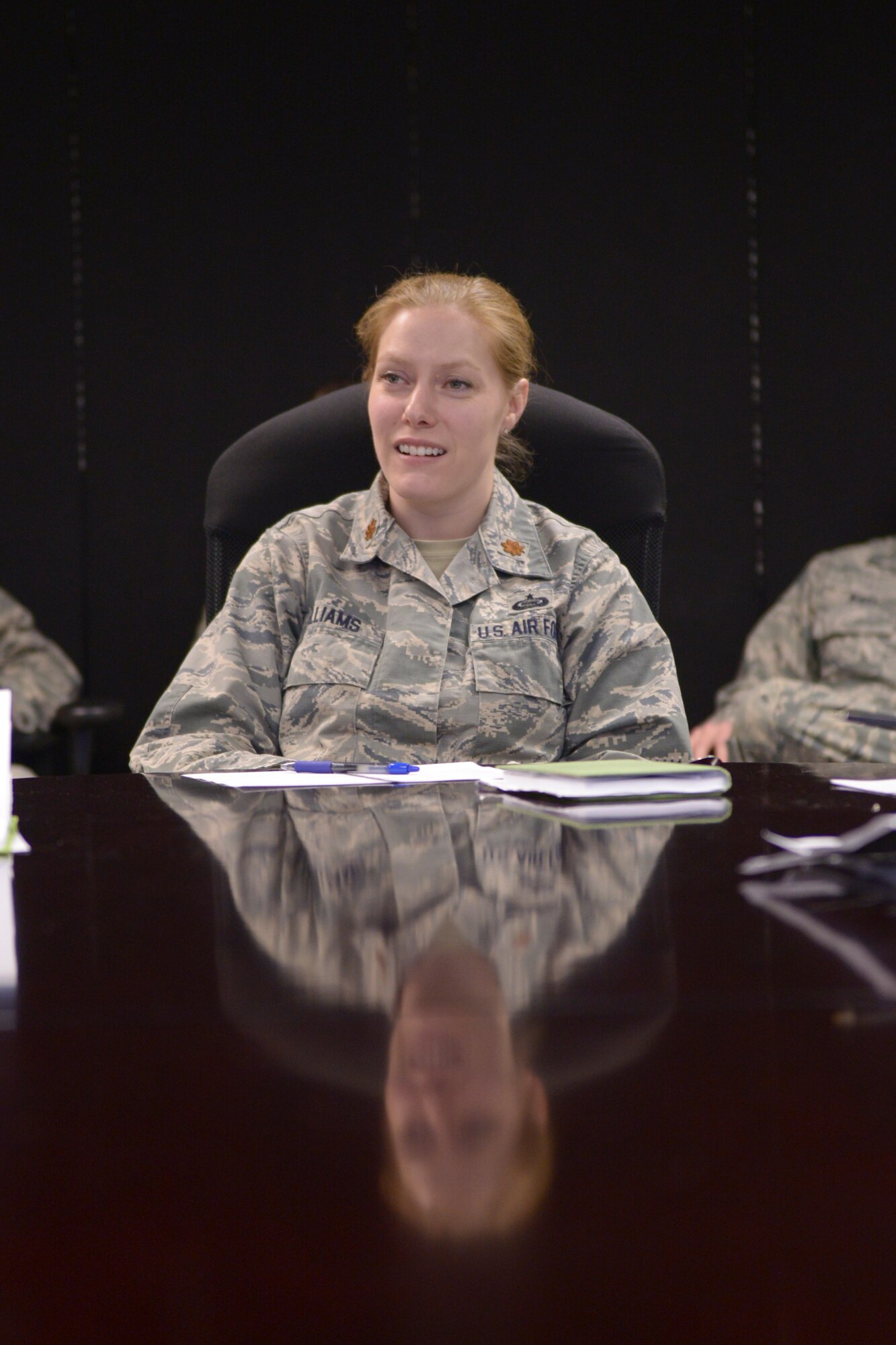 U.S. Air Force Maj. Victoria Williams, the 354th Fighter Wing senior intelligence  officer, holds a training session with her Airmen at Eielson Air Force Base, Alaska, March 26, 2015. Williams set up the training to enhance her Airmen's capability to communicate information properly to audience members. (U.S. Air Force photo by Senior Airman Peter Reft/Released)