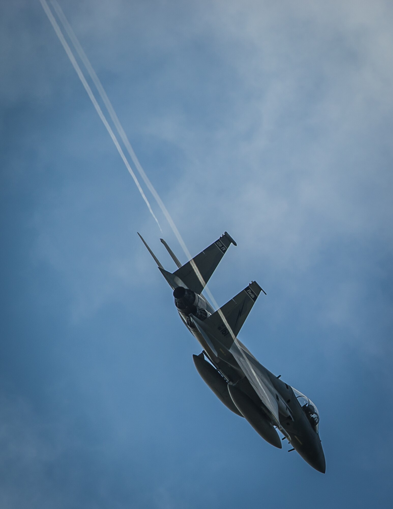 An F-15C Eagle peels off from the formation as it prepares to land at Leeuwarden Air Base, Netherlands, March 31, 2015. F-15C Eagles from the Florida Air National Guard's 159th Expeditionary Fighter Squadron are deployed to Europe as the first ever ANG theater security package here. These F-15s will conduct training alongside our NATO allies to strengthen interoperability and to demonstrate U.S. commitment to the security and stability of Europe. (U.S. Air Force photo/ Staff Sgt. Ryan Crane)