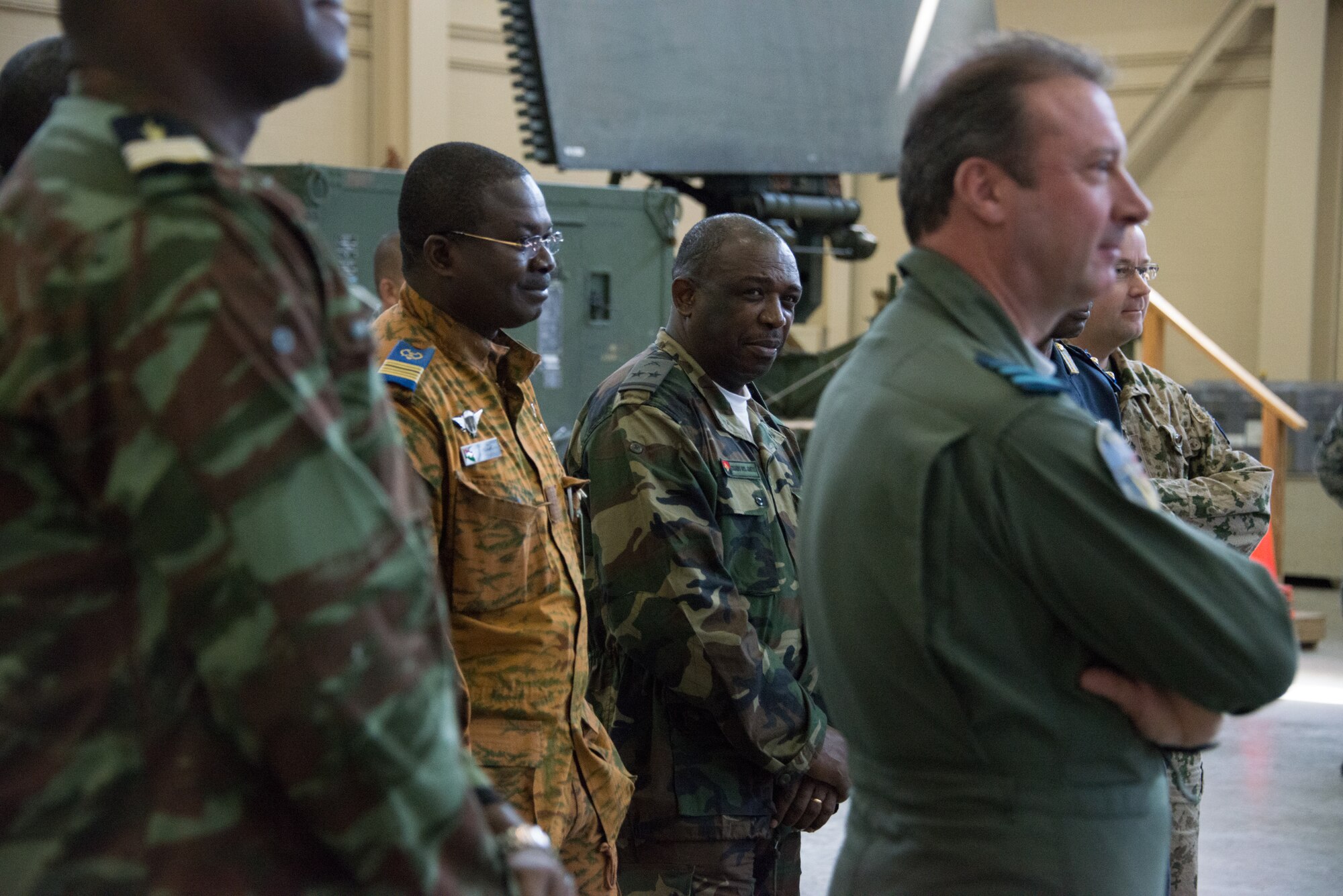 Col. Aime Barthelemy Simpore, from Burkina Faso, Lt. Col. Eduardo Neto, from Angola, and members of the International Air Attaché observe a tower climbing demo from the 338th Training Squadron in Matero Hall March 25, 2015 at Keesler Air Force Base, Miss. The purpose of the visit was to provide these diplomatically accredited international attachés with a view of military, industrial, cultural and social aspects of the United States and facilitate the development of cordial relations. (U.S. Air Force photo by Marie Floyd)