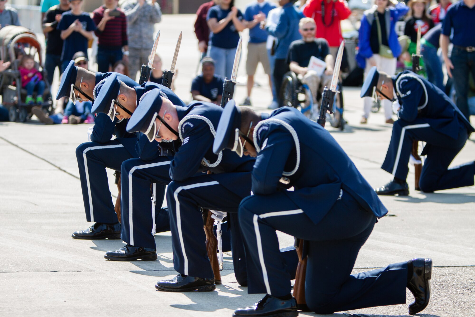 The U.S. Air Force Honor Guard Drill Team unveil their new routine at the Keesler Air Force Base Air Show/Open House March 28, 2015. The drill team began developing their new routine here Feb. 21. The event also included the U.S. Air Force Thunderbirds and Army Golden Knights along with many other performers, static displays and vendors.  Approximately 155,000 people were in attendance for the two-day show. (U.S. Air Force photo by Marie Floyd)