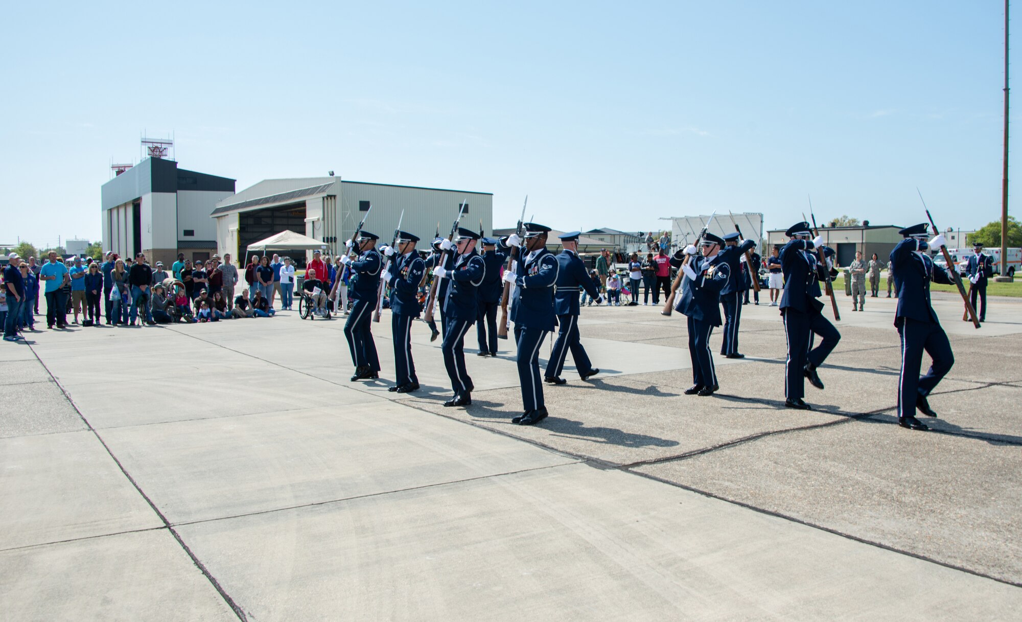 The U.S. Air Force Honor Guard Drill Team unveil their new routine at the Keesler Air Force Base Air Show/Open House March 28, 2015. The drill team began developing their new routine here Feb. 21. The event also included the U.S. Air Force Thunderbirds and Army Golden Knights along with many other performers, static displays and vendors.  Approximately 155,000 people were in attendance for the two-day show. (U.S. Air Force photo by Marie Floyd)