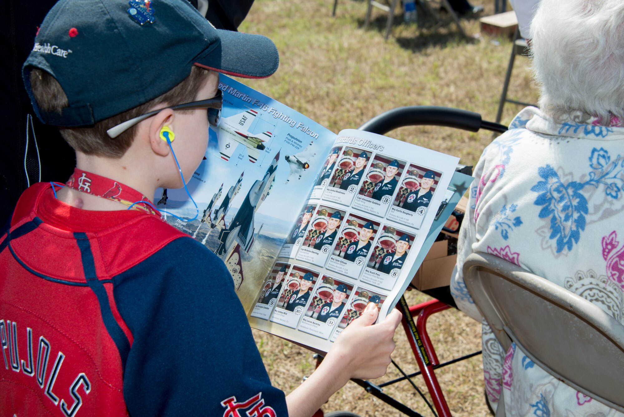 Dell Massy views a U.S. Air Force Thunderbirds program during a Make-A-Wish Foundation meet-and-greet session with the U.S. Air Force Thunderbirds March 27, 2015, at Keesler Air Force Base, Miss. The Thunderbirds are headlining Keesler’s 2015 Air Show/Open House to be held March 28-29. (U.S. Air Force photo by Marie Floyd)