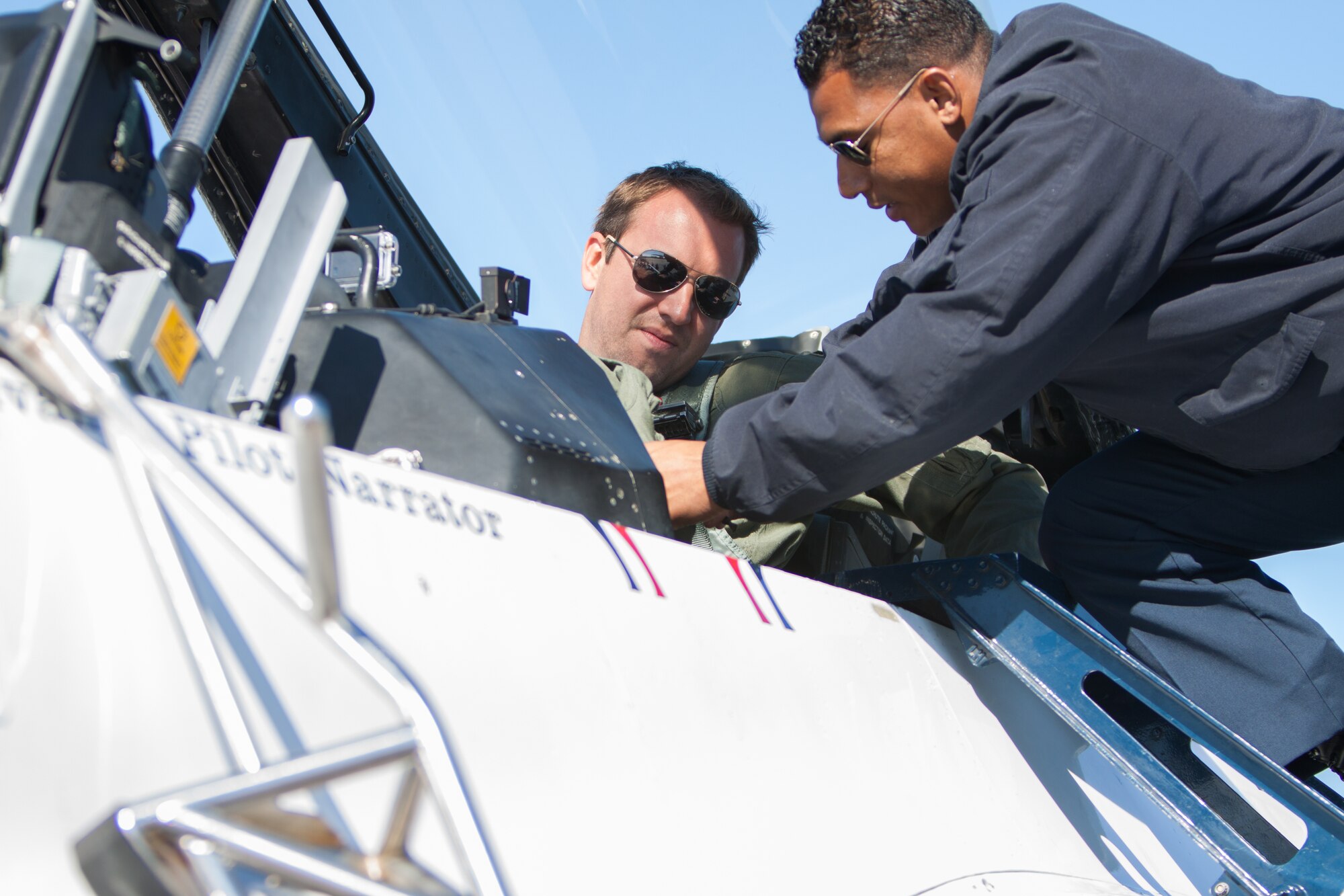 Ryan Mahan, WXXV meteorologist, receives egress training from Staff Sgt. Alexander Reed, U.S. Air Force Thunderbirds tactical aircraft maintenance technician, during flight training March 27, 2015, at Keesler Air Force Base, Miss.  The training was to prepare Mahan for a media flight with the U.S. Air Force Thunderbirds March 27.  The Thunderbirds are headlining Keesler’s 2015 Air Show/Open House to be held March 28-29. (U.S. Air Force photo by Marie Floyd)
