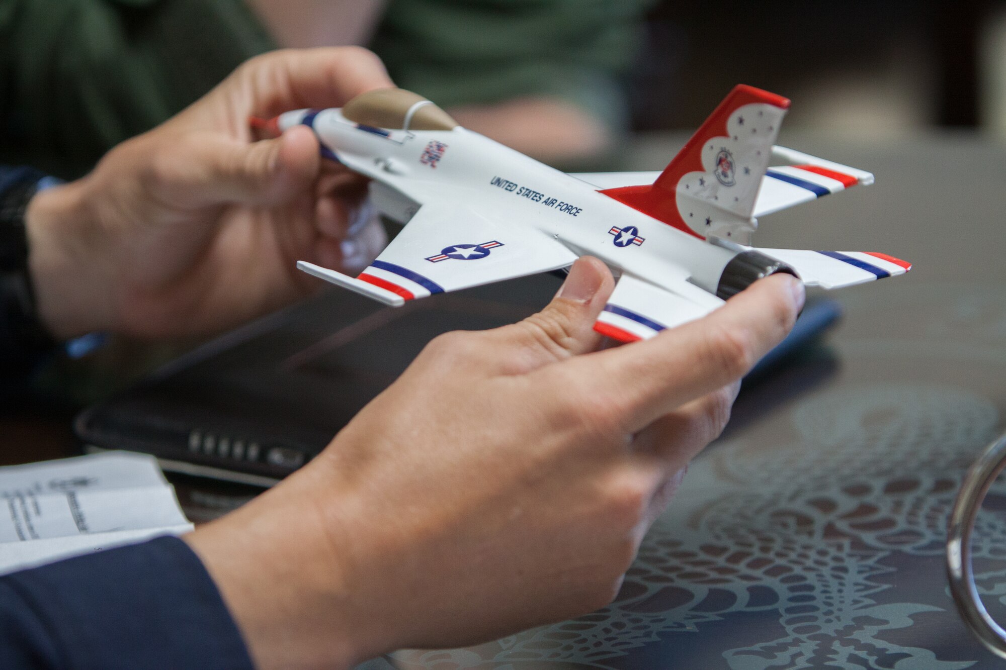 Maj. Scott Petz, U.S. Air Force Thunderbirds advance pilot/narrator #8, briefs Ryan Mahan, WXXV meteorologist, during flight training March 27, 2015, at Keesler Air Force Base, Miss.  The training was to prepare Mahan for a media flight with the U.S. Air Force Thunderbirds March 27.  The Thunderbirds are headlining Keesler’s 2015 Air Show/Open House to be held March 28-29. (U.S. Air Force photo by Marie Floyd)
