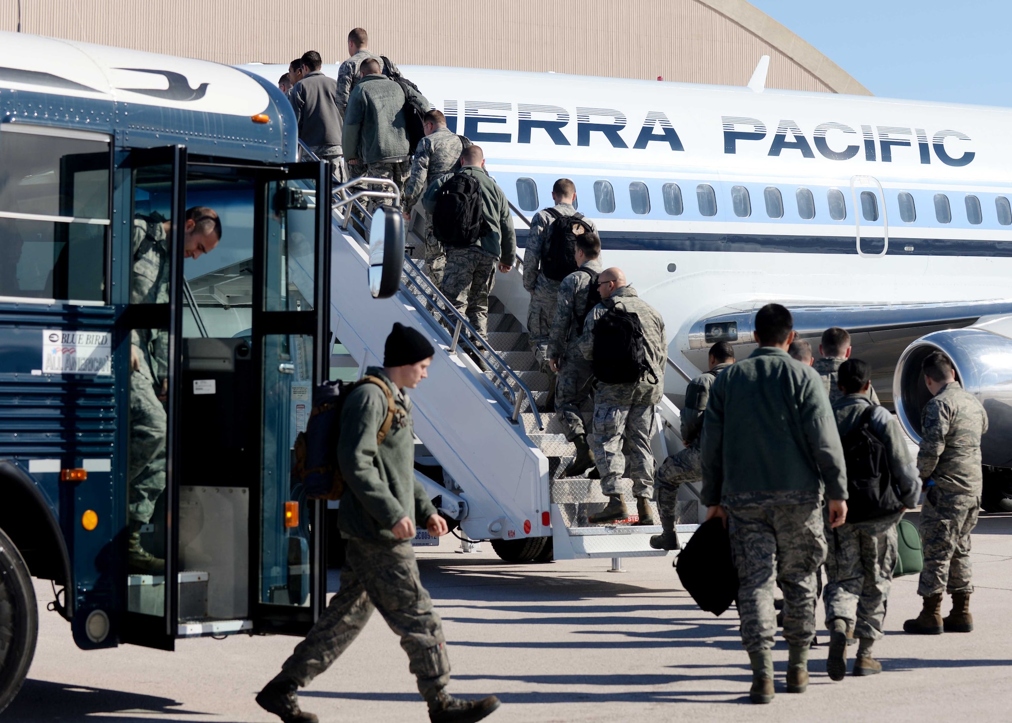 Airmen board a plane for Red Flag 15-2 at Ellsworth Air Force Base, S.D., Feb. 26, 2015. Red Flag is a joint aerial training exercise that provides realistic training in a combined air, ground, space and electronic threat environment. (U.S. Air Force photo by Airman 1st Class Rebecca Imwalle/Released)