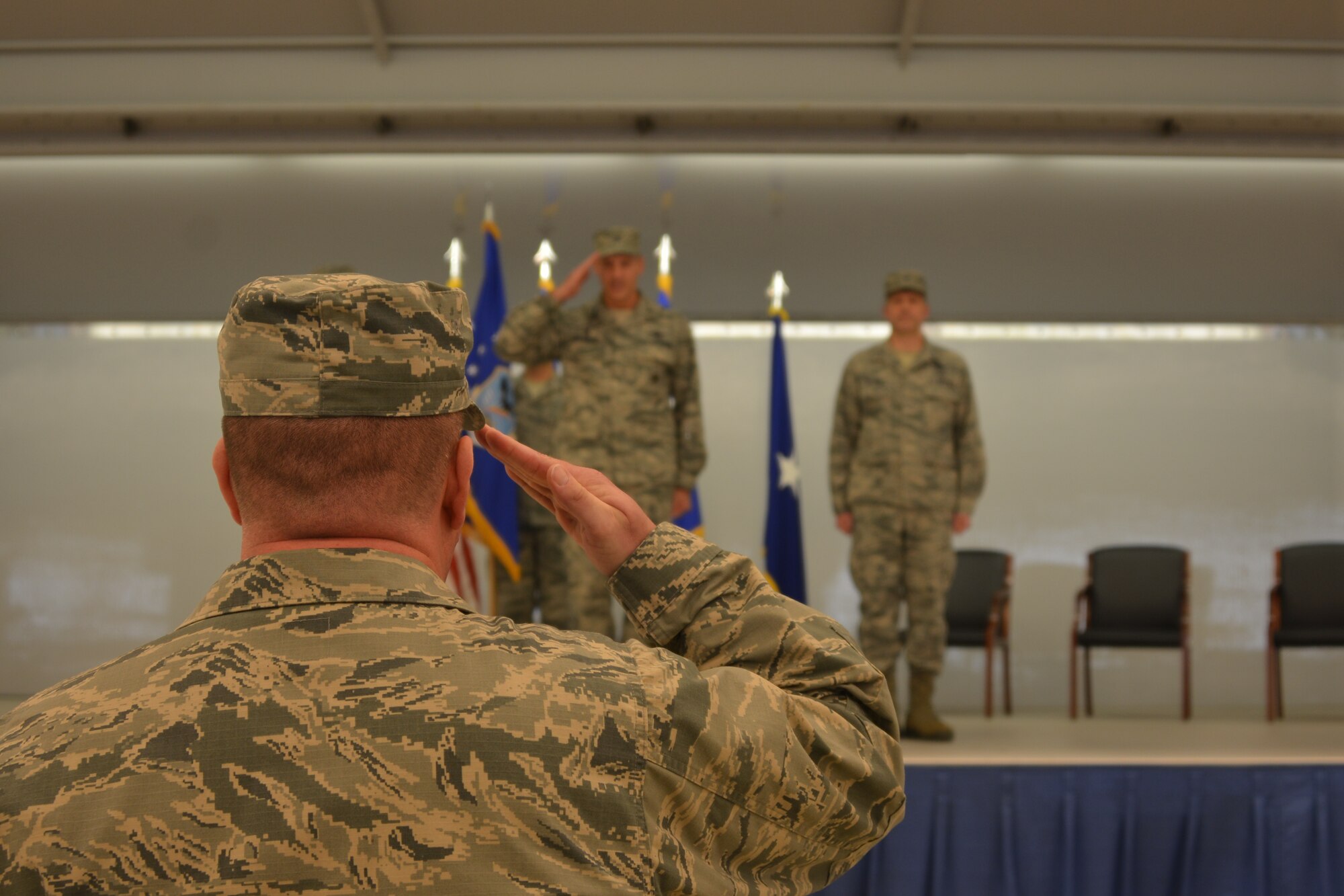Airmen of 477th Fighter Group salute the new incoming 477th Fighter Group commander, David Piffarerio, during the unit’s change of command ceremony Friday at Hangar 25. (US Air Force photo/Tech. Sgt. Dana Rosso)