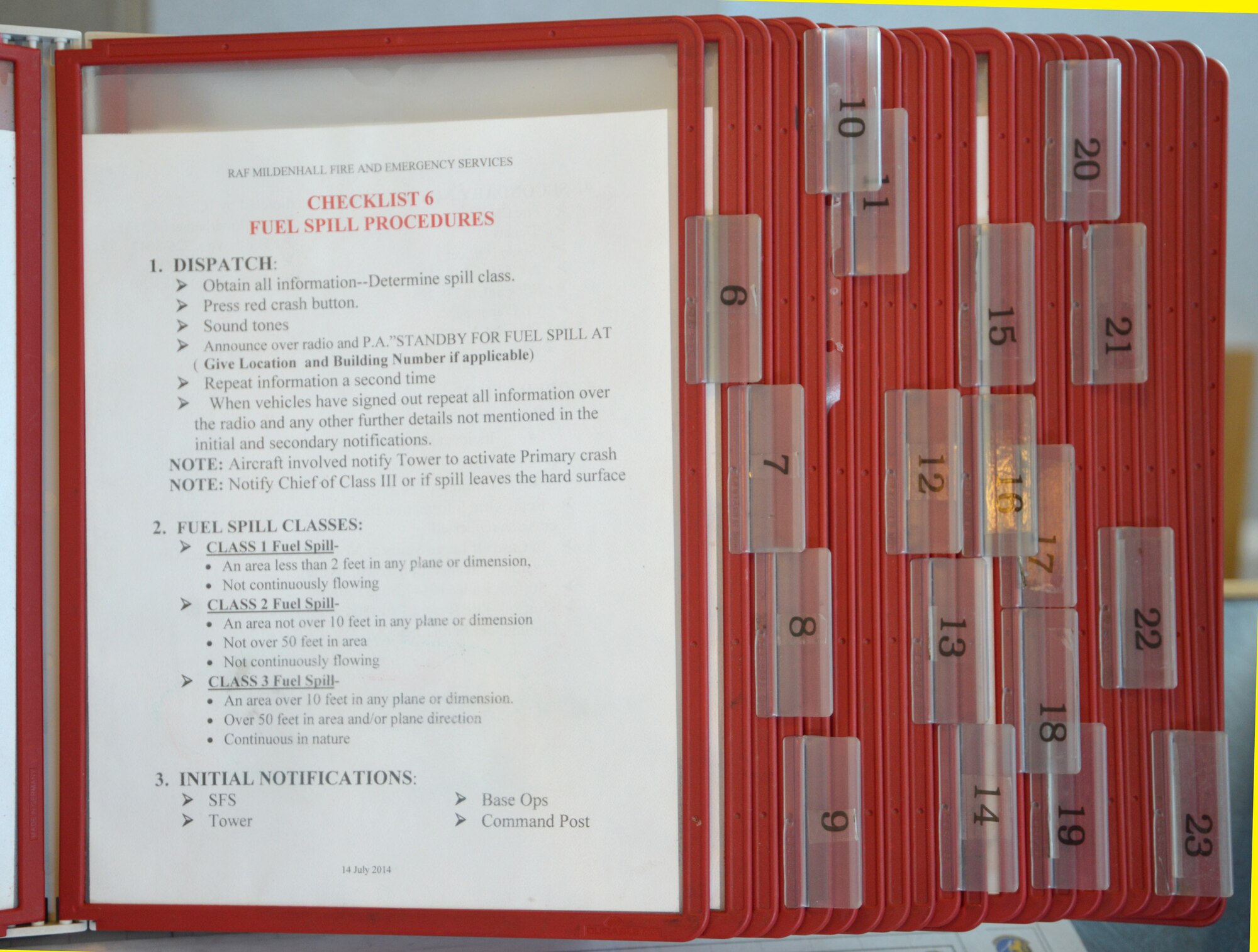 Checklists are kept in the 100th Civil Engineer Squadron Fire Emergency Services Flight emergency communication center Feb. 17, 2015, on RAF Mildenhall, England. They aid in emergency response by ensuring the firefighters follow correct procedures, notifications are made and all relevant information is gathered before arriving on scene. (U.S. Air Force photo by Karen Abeyasekere/Released)