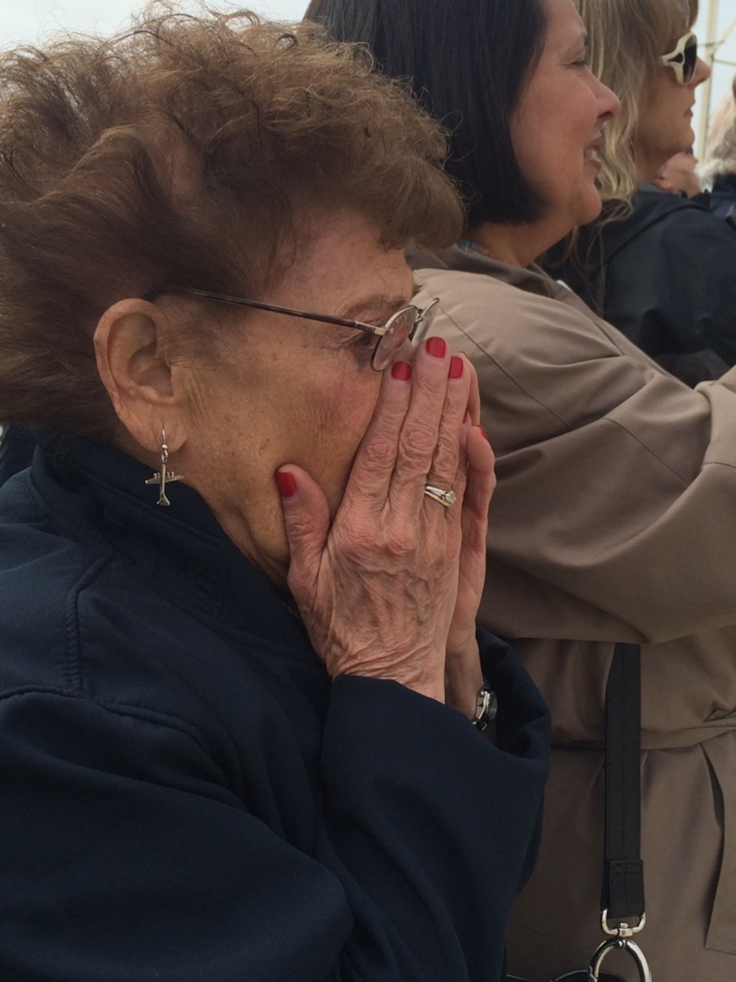 Connie Palacioz, who worked at the Wichita Boeing B-29 Superfortress plant from 1943 until 1945, becomes emotional at a Wichita, Kansas B-29 rollout ceremony March 23, 2015. Palacioz worked to help restore the aircraft for the last 15 years and installed the original rivets for the pilot section in the 1940s. She began to cry thinking of all the other "Rosie the Riveters" she worked with who could not be there that day, the 90-year-old said. (U.S. Air Force Photo by 1st Lt. Jessica Brown)