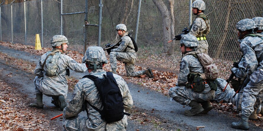 PETERSON AIR FORCE BASE, Colo. – Team Pete, represented by six Reserve and five Active Duty Force Support Squadron members, work together to find unexploded ordnance and improvised explosive devices during the OPERATION Everybody Panic event of the 2015 FSS Readiness Challenge at Dobbins Air Reserve Base, Ga. March 11, 2015. OPERATION Everybody Panic tests participants’ knowledge of their Airman’s Manual, mental stamina and physical fitness. It was necessary for the team to run and crawl to reach their objectives during this timed event. (U.S. Air Force photo/Senior Master Sgt. Vicki Robertson)