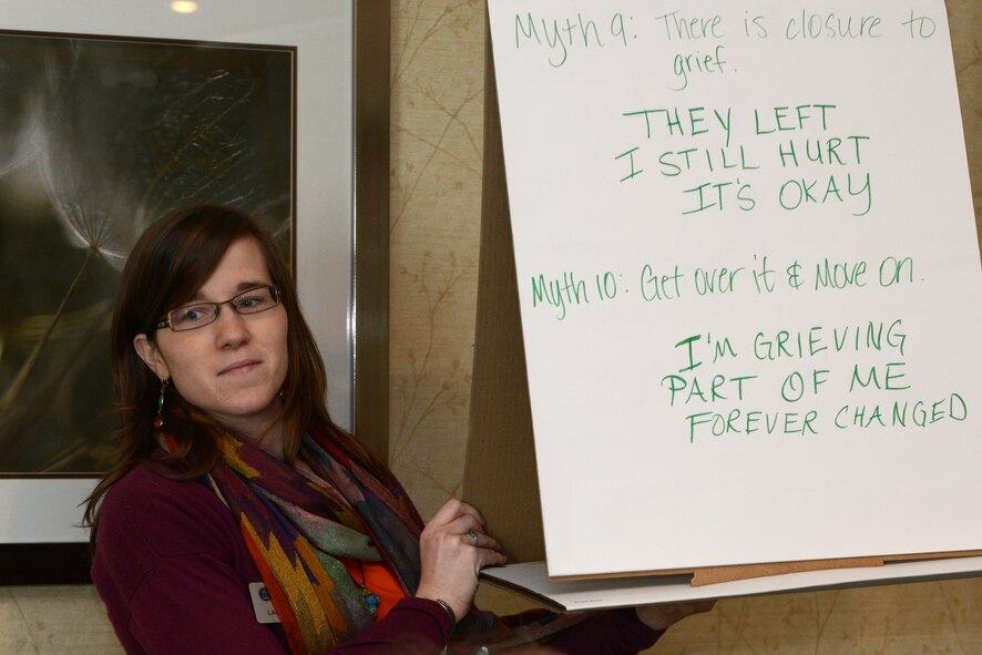 Laura Walton, Lowndes County 4-H youth extension agent, holds up a poster during the Living in the New Normal Institute March 25, 2015, at a hotel in Valdosta, Ga. The participants created haikus based off myths of grief during the activity. (U.S. Air Force photo by Airman 1st Class Kathleen D. Bryant)