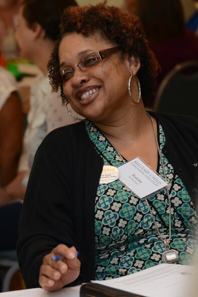 Katrina Royal, Wiregrass Georgia Technical College student success coordinator, laughs as she introduces herself at the start of Living in the New Normal Institute March 25, 2015, at a hotel in Valdosta, Ga. Participants learned how to identify resources available to help develop strength and flexibility in children dealing with change. (U.S. Air Force photo by Airman 1st Class Kathleen D. Bryant)
