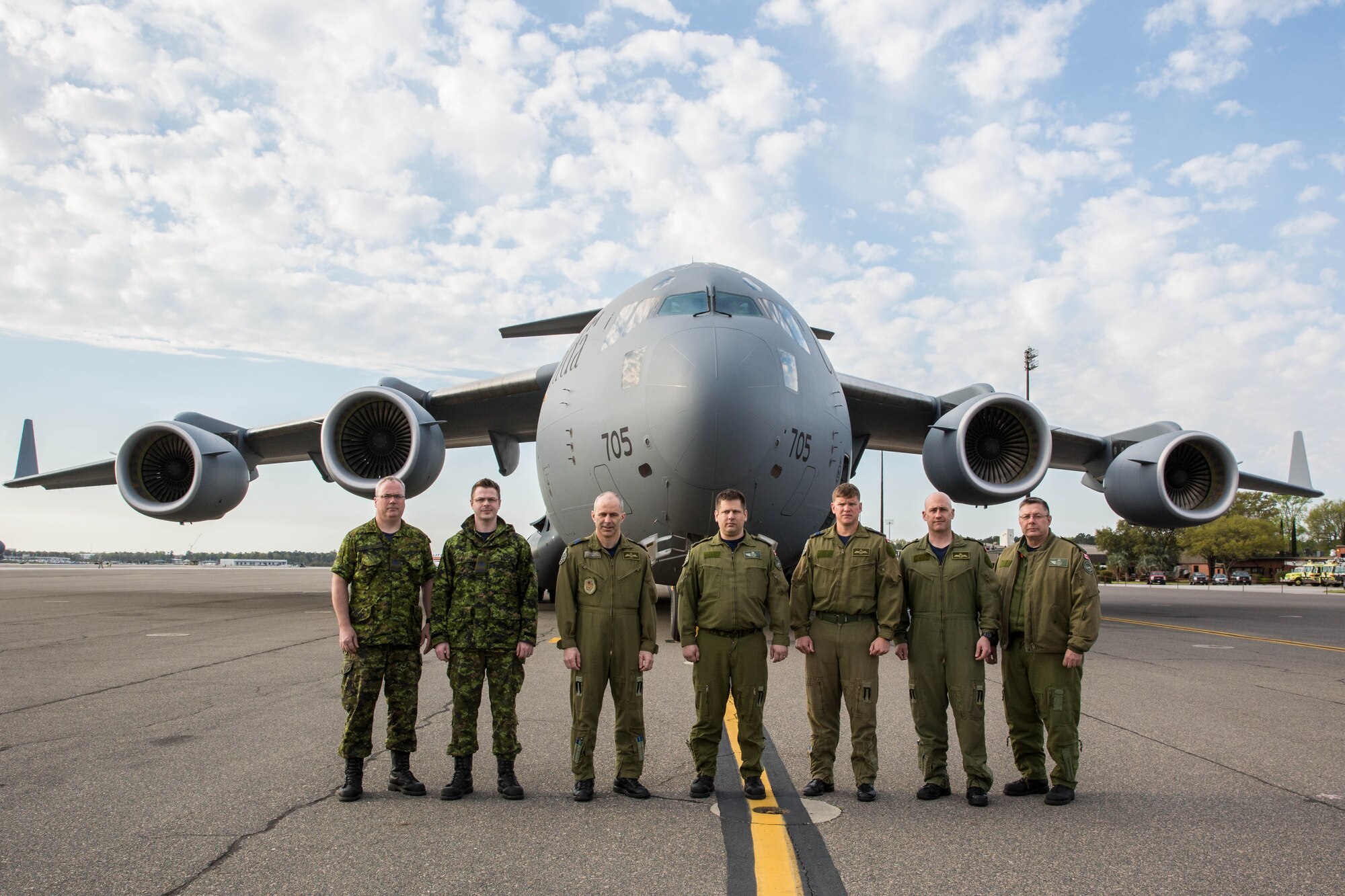 Members of the 429th Transportation Squadron stand in front of a new CC-177 Globemaster III aircraft during a brief stop at Joint Base Charleston, South Carolina March 30, 2015 while en route to 8 Wing Trenton, Ontario to deliver the squadron's fifth CC-177 to the Royal Canadian Air Force. The 429th TS started flying the CC-177 in July 2007, and the primary mission of the squadron is to provide responsive domestic global airlift to support the Canadian armed forces through humanitarian and support missions around the globe. The CC-177 is the Royal Canadian Air Force’s version of the C-17 Globemaster III flown by the U.S. Air Force. (U.S. Air Force Photo by Tech. Sgt. Shane Ellis)