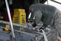 HILL AIR FORCE BASE, Utah – Air Force Reserve Tech. Sgt. Jeremy Rogers, a 910th Airlift Wing Aerial Spray Maintainer, disconnects a hose from a Modular Aerial Spray System (MASS) aboard a modified C-130H Hercules tactical cargo aircraft, assigned to the 910th based at Youngstown Air Reserve Station, Ohio, on the flightline here in preparation for an aerial spray sortie, March 17, 2015. Rogers and other members of the 910th’s Aerial Spray Maintenance Flight are loading the aircraft’s MASS with a herbicide which was sprayed over the nearby Utah Test and Training Range (UTTR), eliminating unwanted ground covering weeds which can obscure target sites and Unexploded Ordinance (UXO) on bombing ranges. The 910th Airlift Wing is home to the Department of Defense’s (DoD) only large-area fixed wing aerial spray capability and dedicated aerial spray maintenance flight. U.S. Air Force photo by Tech. Sgt. Rick Lisum