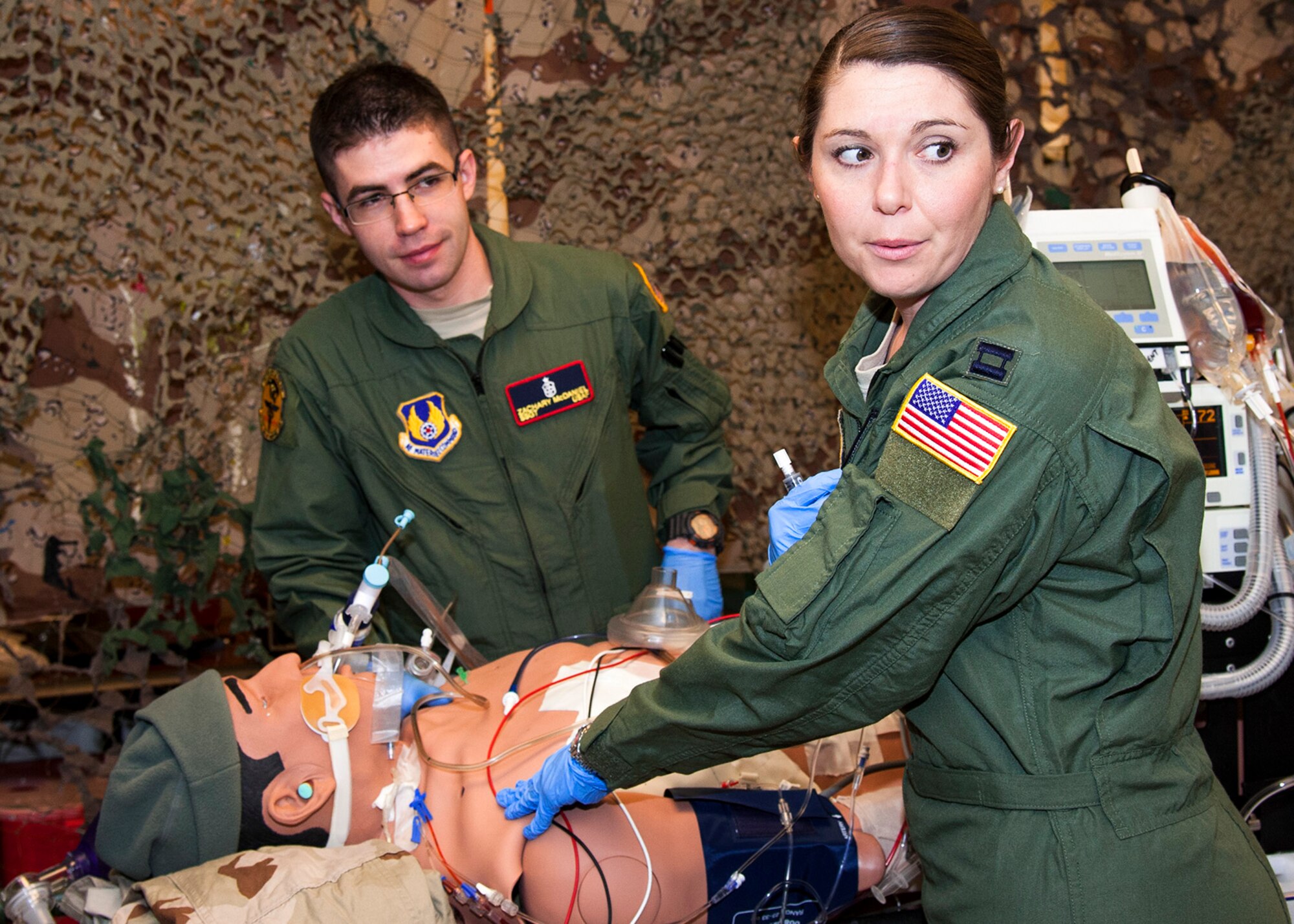 Capt. Joanna Cooley, a nurse with the 96th Medical Group’s Critical Care Flight, and Staff Sgt. Zachary McDaniel, a respiratory therapist with the 96th MDG CCF, assess their mock patient during training Feb. 24 at Eglin Air Force Base Fla.  The Critical Care Air Transport Team performs sustainment training in a simulated aircraft environment to hone their deployment and emergency response skills under stressful conditions. CCATT crews manage multiple critically ill and injured service members on flights around the world to ensure their survival.  (U.S. Air Force photo/Ilka Cole)