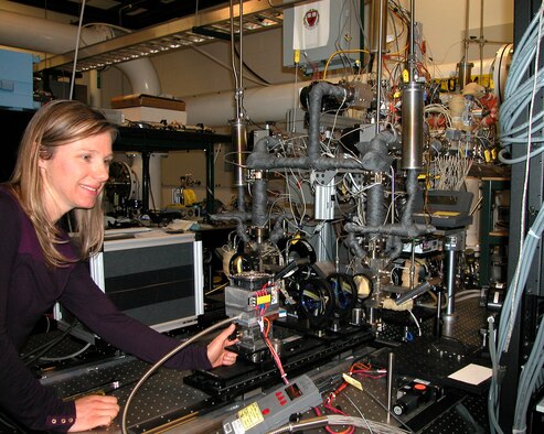 Air Force Research Laboratory engineer Dr. Carrie Noren operates the Directed Energy Directorate's diode pumped alkali laser, a laser system AFRL designed and built. Noren was a former AFRL Directed Energy Scholar. (U.S. Air Force photo/Anita Collins)