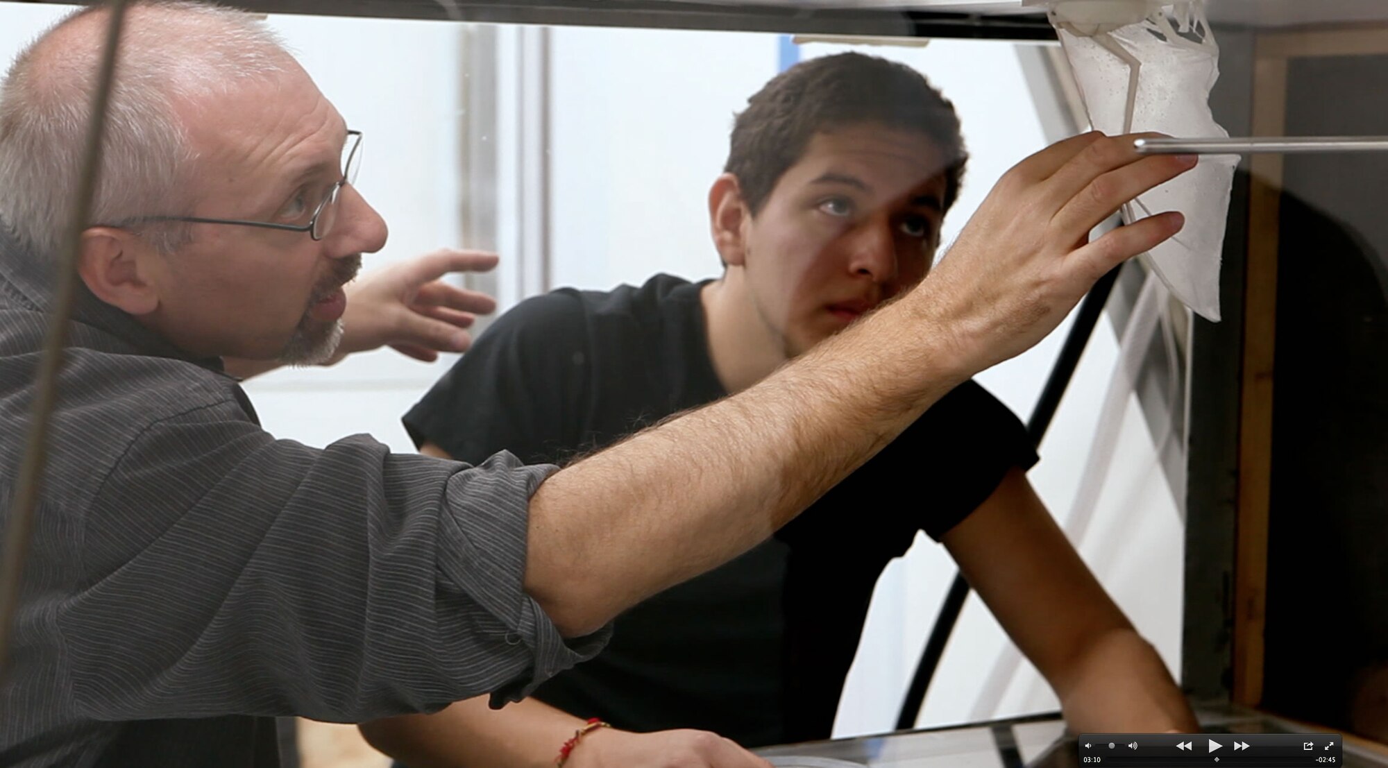 Prof. Kenny Breur, Engineering Department, Brown University, shows one of his graduate students how to adjust a simulated bat wing for testing in the wind tunnel.  Breur studies the fluid motion of how bats fly in nature so his research team can apply it to designing human engineered vehicles.  Researchers at the Air Force Research Laboratory have been working on high fidelity simulations of flexible wings in collaboration with the wind tunnel work being conducted at Brown University. (U.S. Air Force Photo/AFOSR Staff)