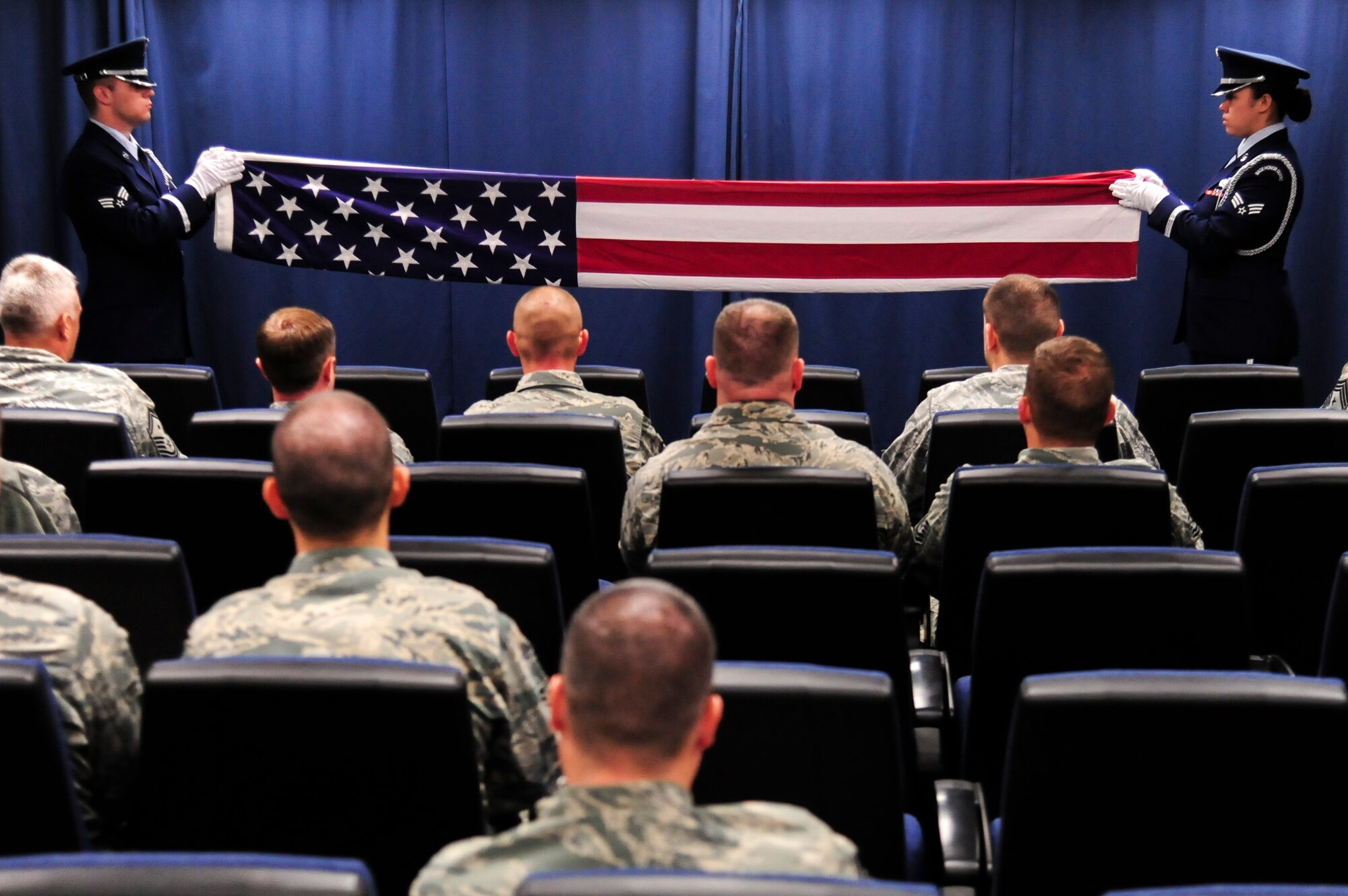 Members of the 4th Fighter Wing Honor Guard fold a flag during a remembrance ceremony for retired Chief Master Sgt. of the Air Force James C. Binnicker, the ninth CMSAF, March 27, 2015, at Seymour Johnson Air Force Base, North Carolina. The flag flew in front of the base’s Airman Leadership School, which bears Binnicker’s namesake. (U.S. Air Force photo/Senior Airman Brittain Crolley)