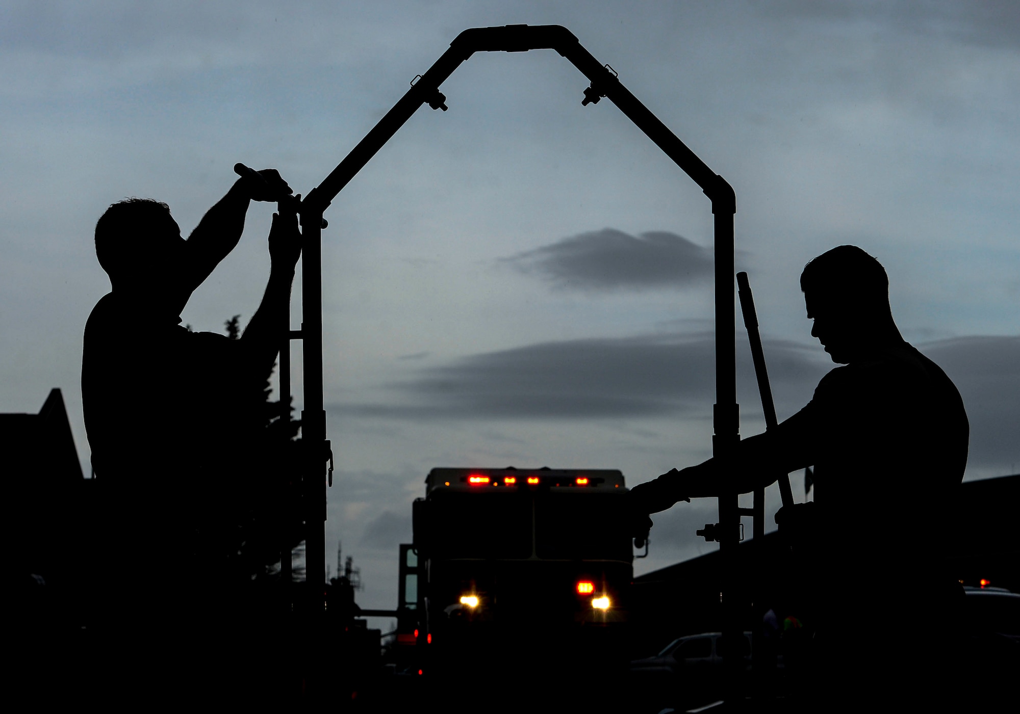 U.S. Air Force firefighters construct a decontamination station at Langley Air Force Base, Va., March 26, 2015. Emergency responders participated in a chemical, biological, radiological, nuclear and high-yield explosive threat exercise and were tested on their ability to plan, organize, train and respond to threats. (U.S. Air Force photo by Senior Airman Kayla Newman/Released)