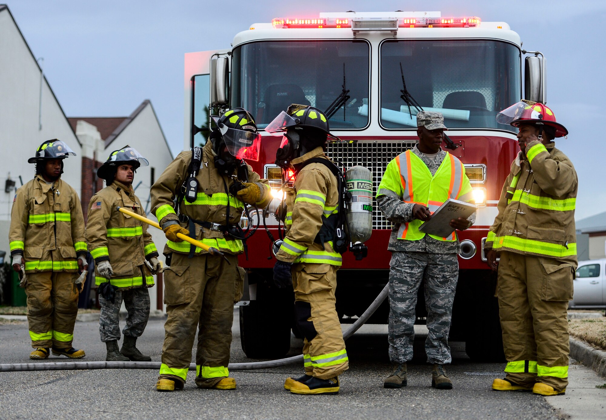 U.S. Air Force firefighters prepare for a chemical, biological, radiological, nuclear and high-yield explosives exercise at Langley Air Force Base, Va., March 26, 2015. Emergency response teams were tested on the execution of required procedures to eliminate a CBRNE threat.  (U.S. Air Force photo by Senior Airman Kayla Newman/Released)