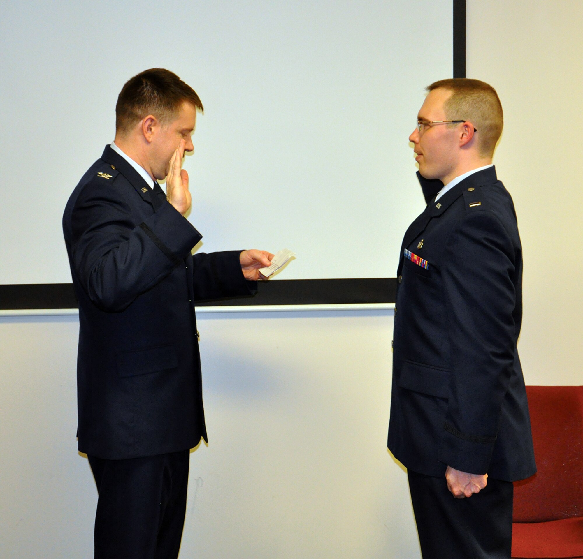 WRIGHT-PATTERSON AIR FORCE BASE, Ohio – The 445th Aeromedical Staging Squadron celebrated the promotion of one of their own March 21, 2015. Tech. Sgt. Jonathan D. Charles was commissioned as a second lieutenant in the Medical Service Corps. Col. Jeffrey S. Beery, 445th ASTS commander, officiated the ceremony. Charles will remain a member of the squadron where his hard work and dedication is truly appreciated. (U.S. Air Force photo/Maj. Demetrius Smith)