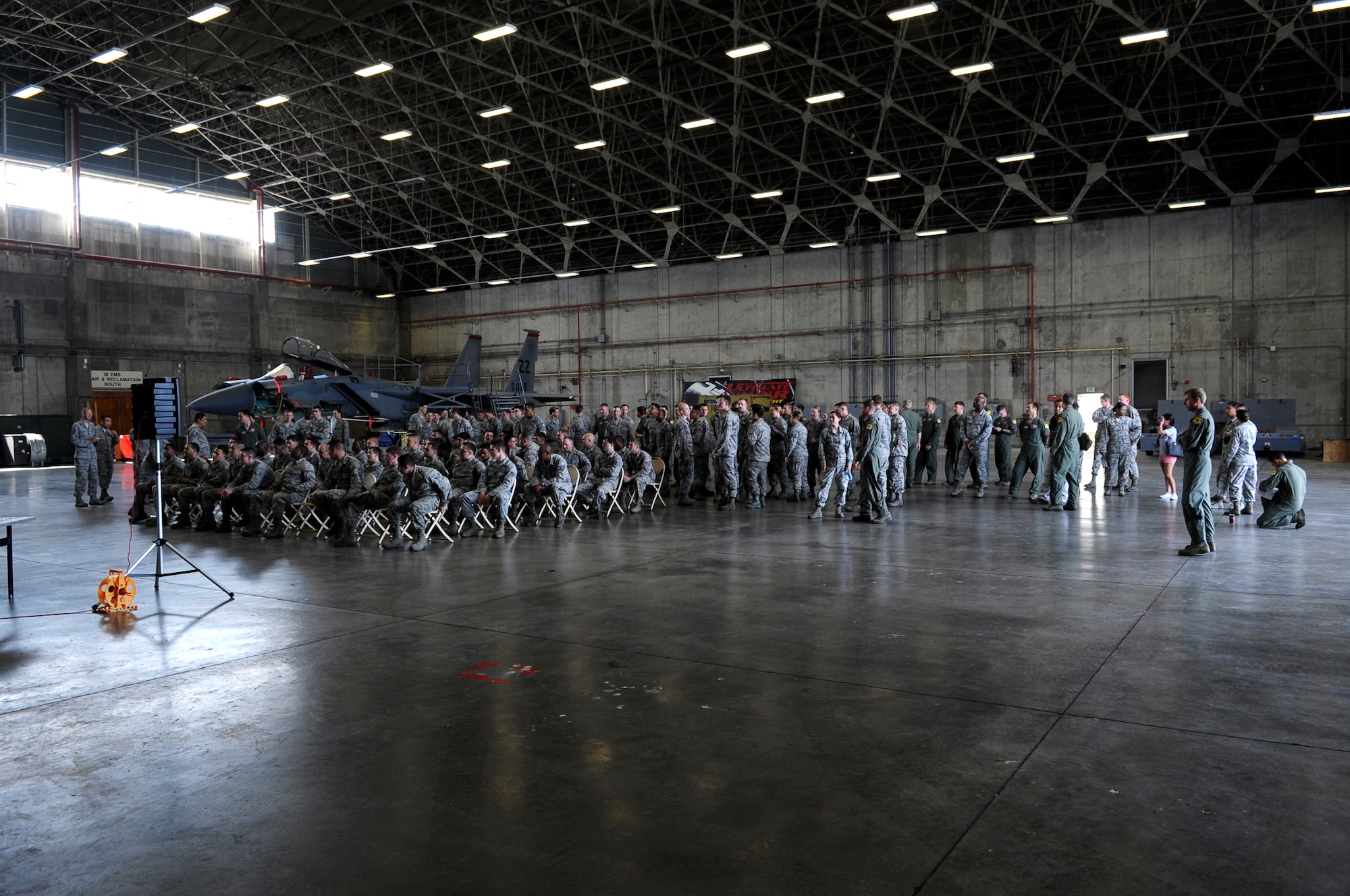 A group of Airmen from the 67th Fighter Squadron and 67th Aircraft Maintenance Unit gather for the Dedicated Crew Chief ceremony here at Kadena Air Base, Japan, March 31, 2015. During this ceremony crew chiefs are recognized for their hard work and are paired with a pilot and aircraft. (U.S. Air Force photo by Airman 1st Class Zackary A. Henry)