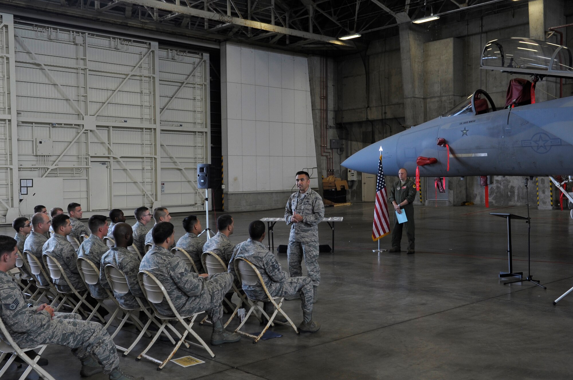 U.S. Air Force Lt. Col. John Tran, 18th Aircraft Maintenance Squadron commander, addresses the new dedicated crew chiefs and dedicated assistant crew chiefs during their ceremony March 31, 2015 at Kadena Air Base, Japan. The Dedicated Crew Chief Ceremony is meant to recognize the crew chiefs for their hard work to ensuring aircraft are properly maintained. (U.S. Air Force photo by Airman 1st Class Zackary A. Henry)